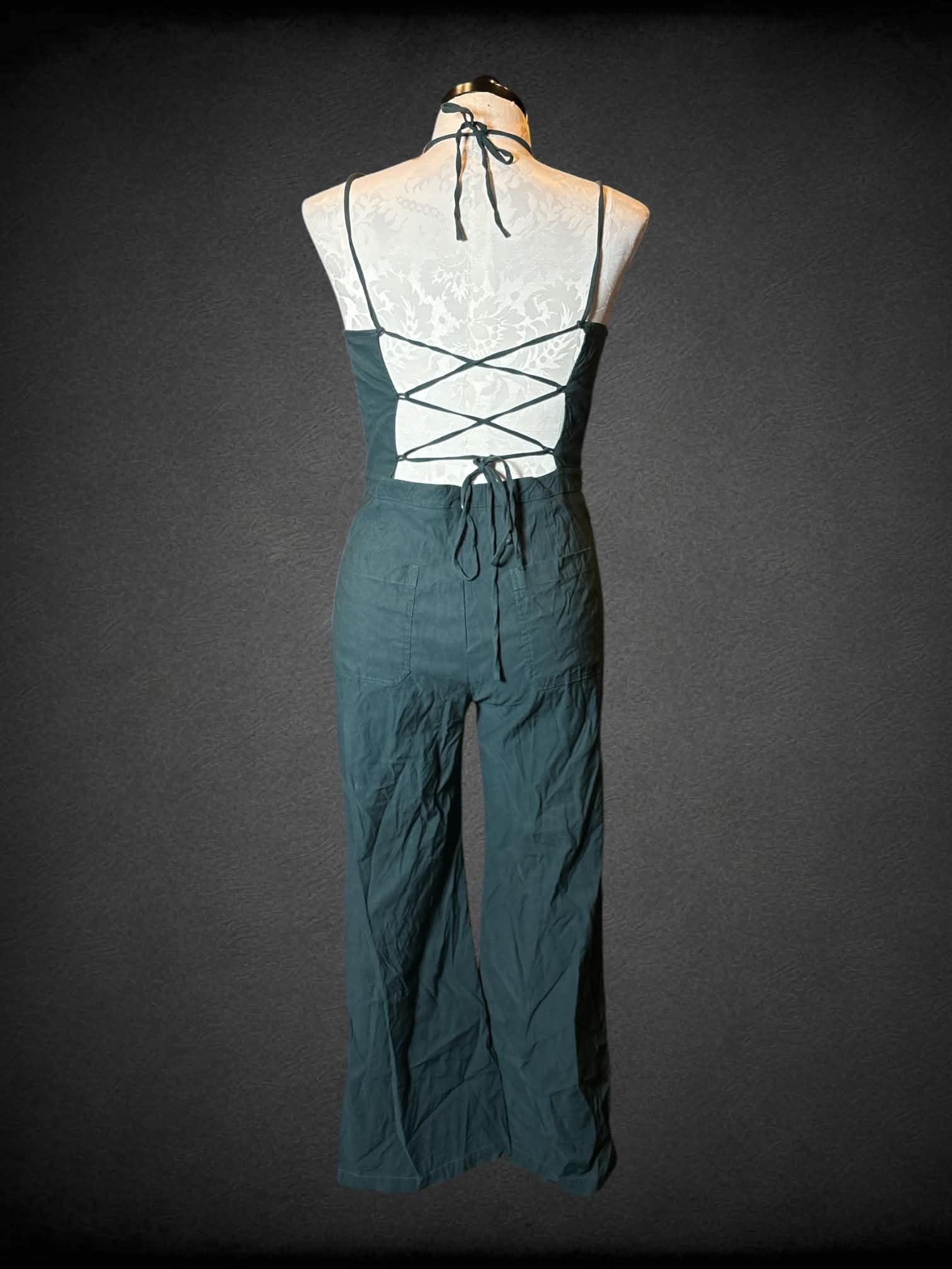 0X Anthropologie green jumpsuit with open lace-up back, and pockets