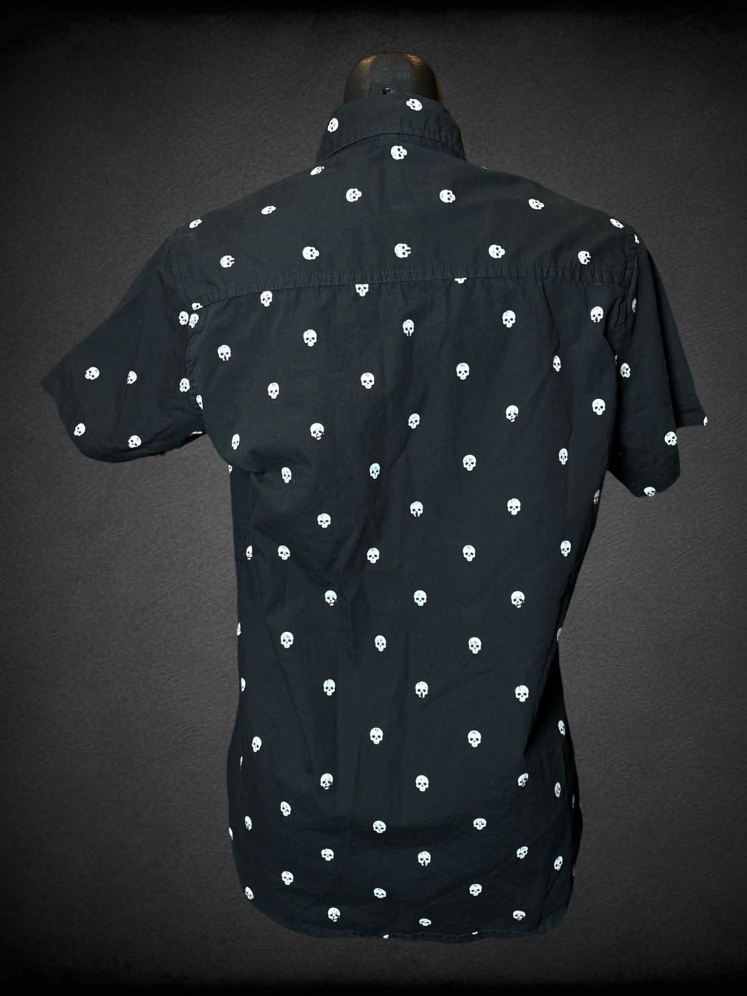 M Free Planet black button-up shirt with skull pattern and pocket on front