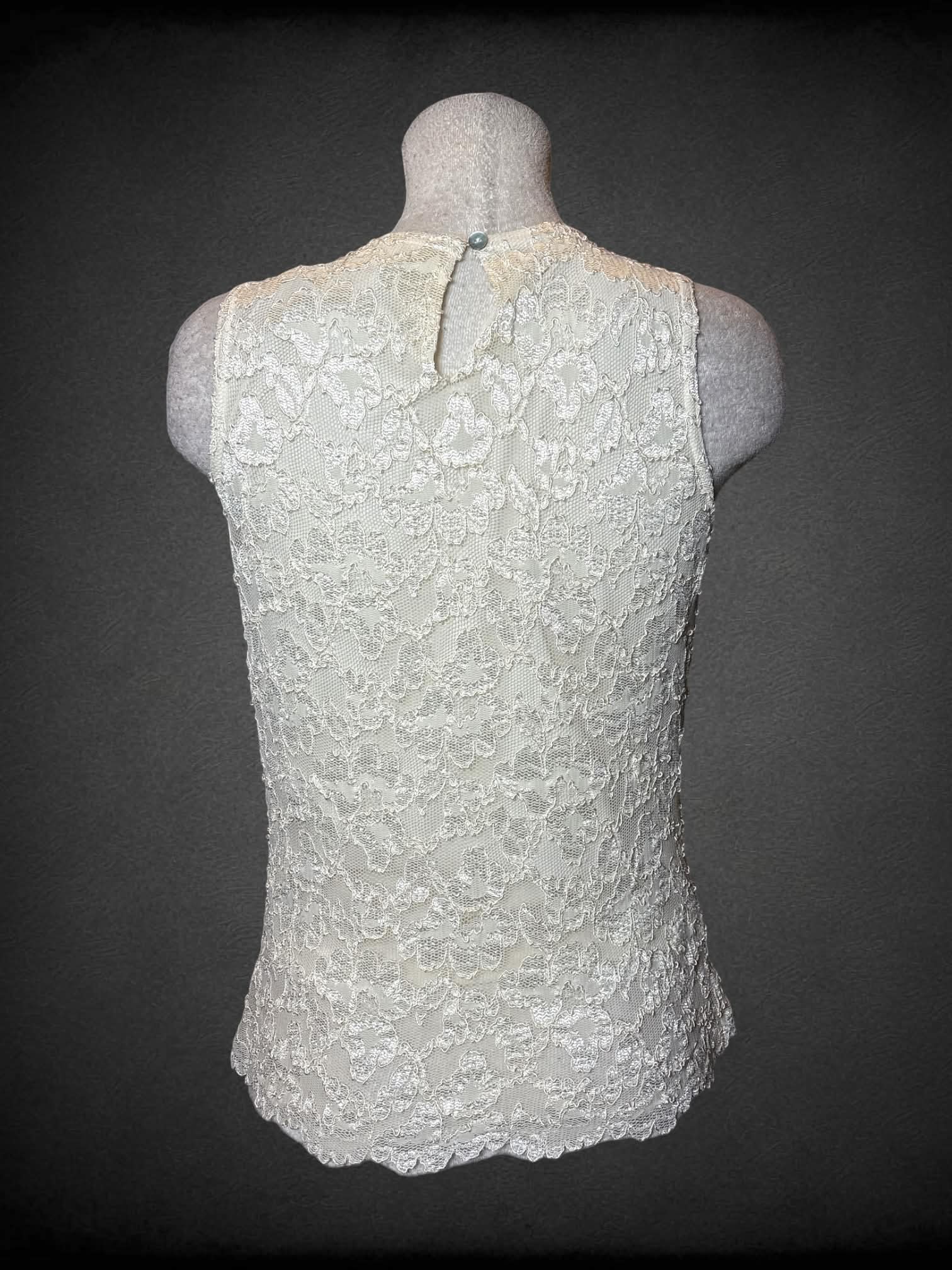 L California Style vintage white sleeveless top with floral lace outer layer, and button on back