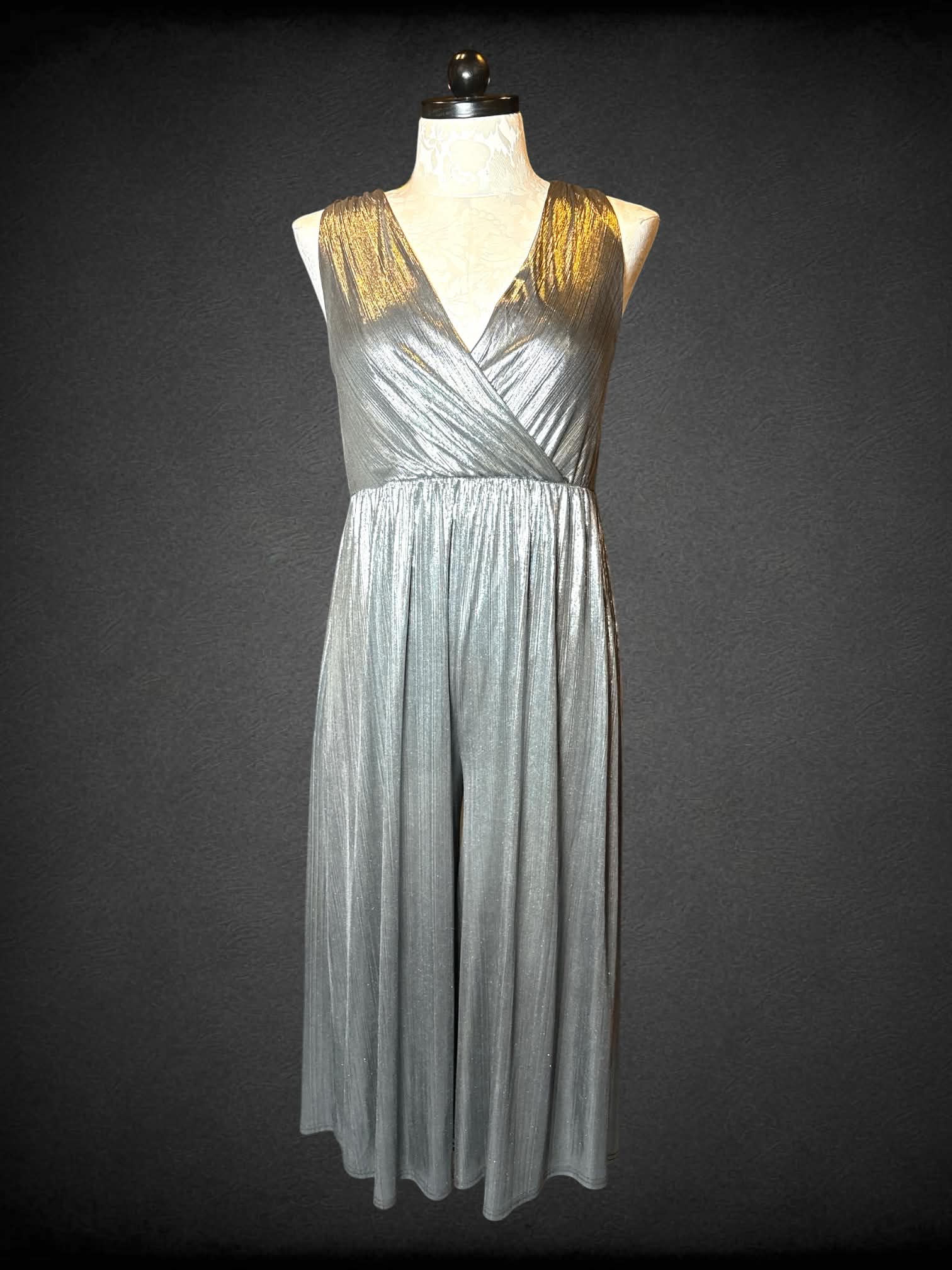 0X Francesca’s silver ribbed jumpsuit with zipper on back