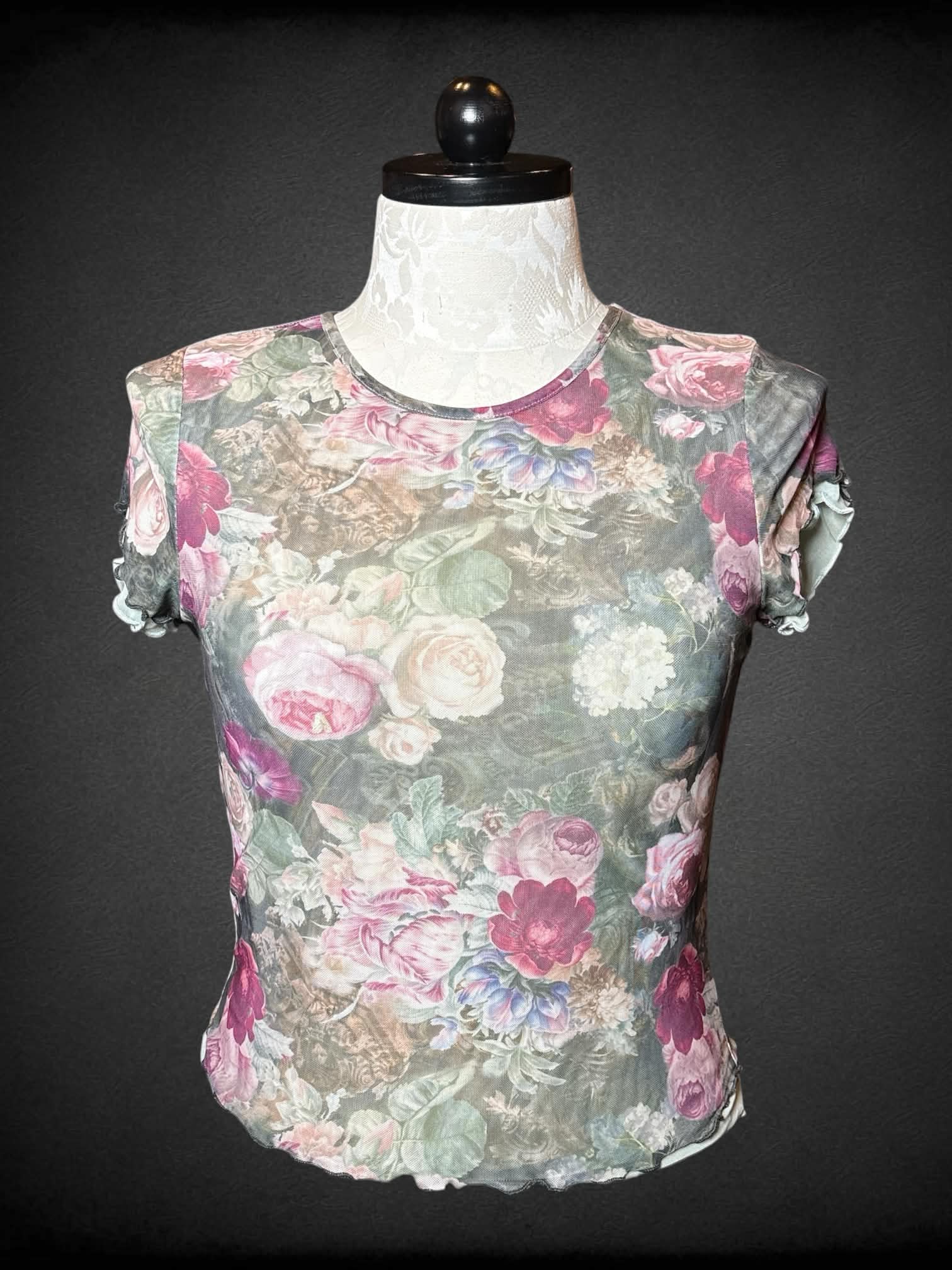 1X Almost Famous green sheer fitted top with floral pattern, and ruffle hem