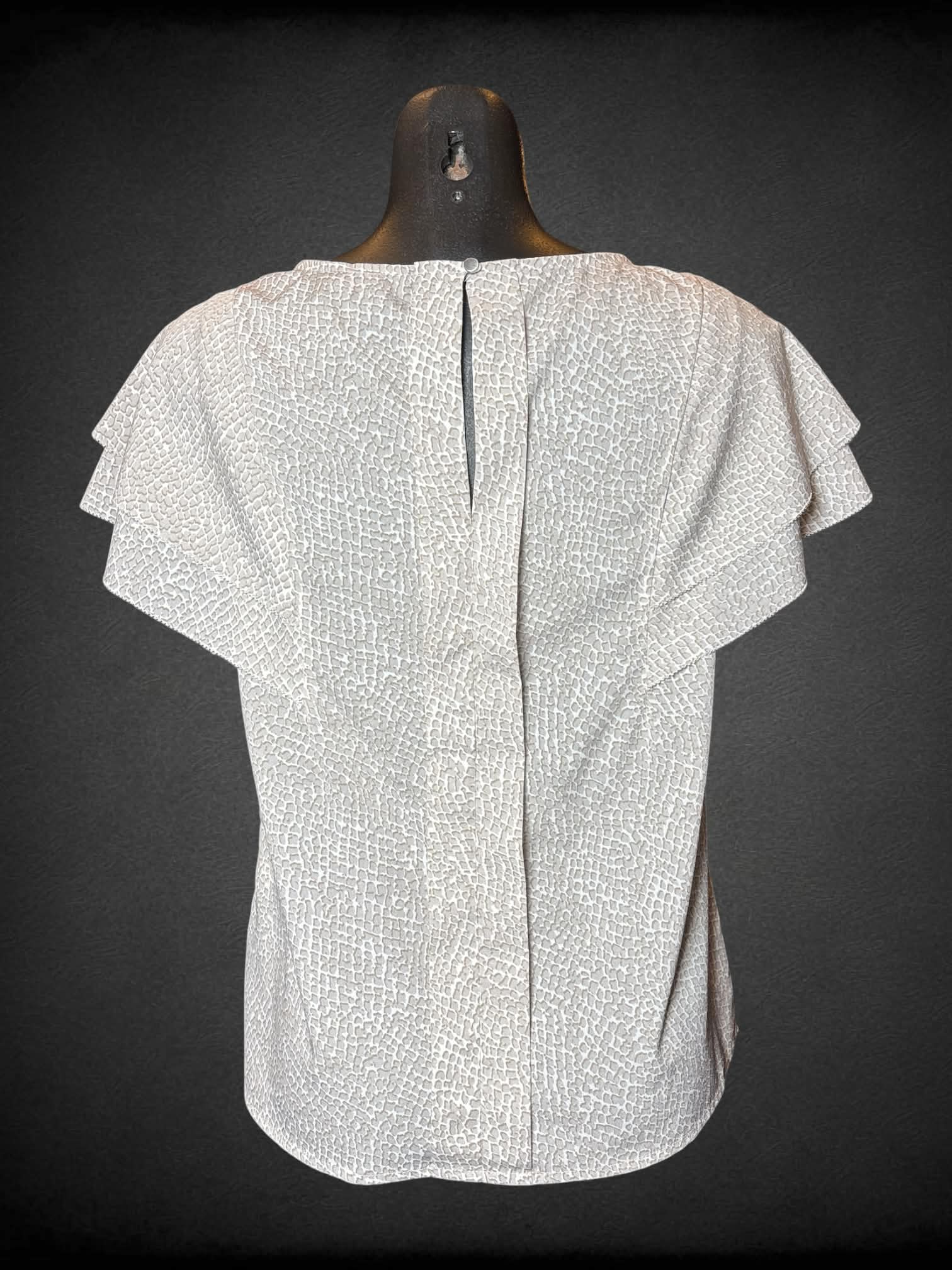 M Banana Republic white flowy blouse with spotted brown pattern, and button on back