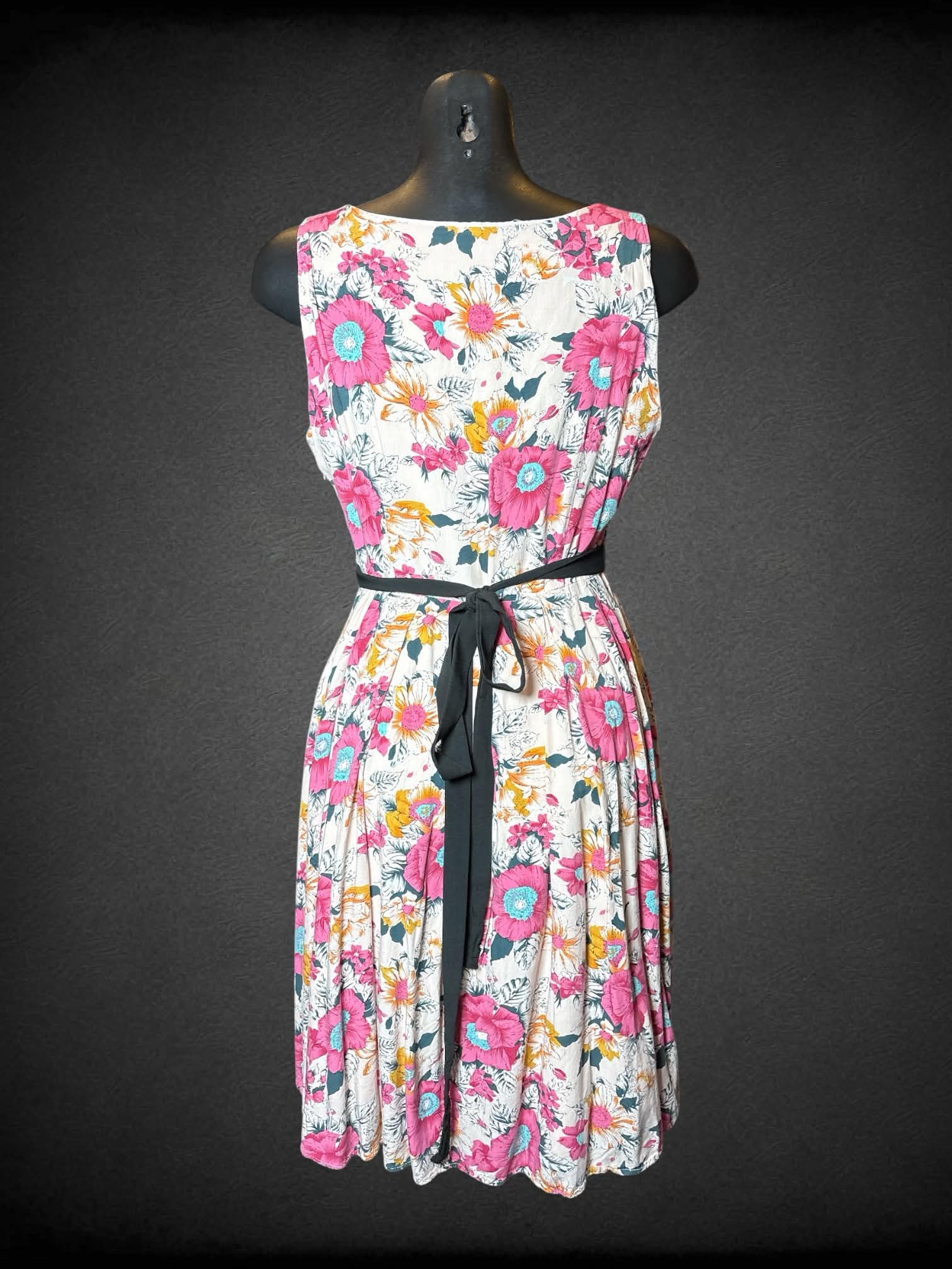 M Frock Shop pink dress with floral pattern, pockets, zipper on side and adjustable tie on waist