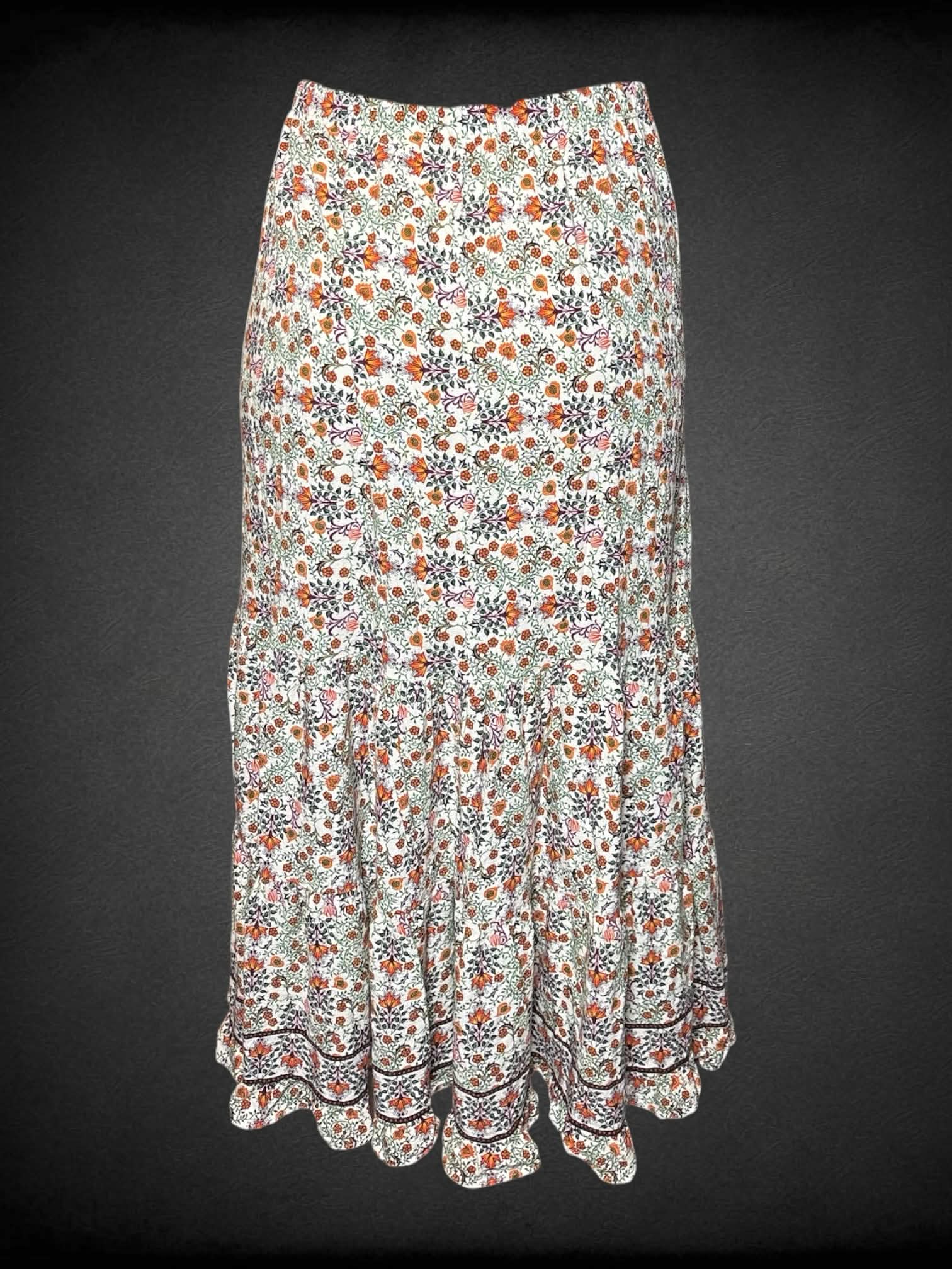 L Max Studio white flowy skirt with colorful botanical pattern, and stretch waist