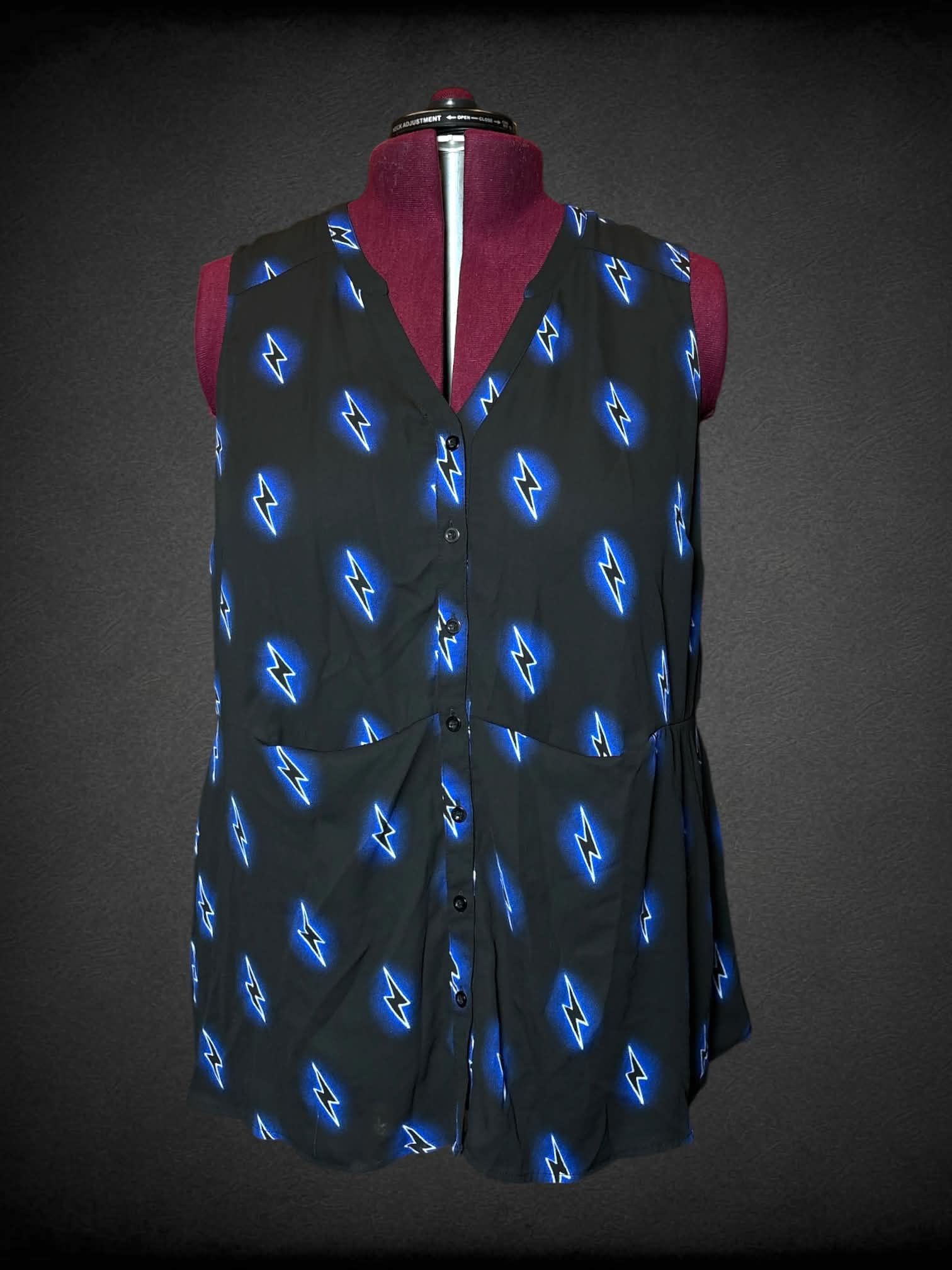2X black button-up shirt with blue neon lightning bolt design