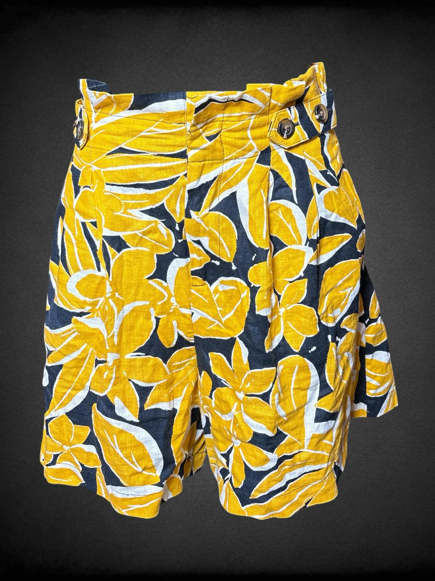 S Who What Wear black high-waisted shorts with yellow floral pattern, decorative buttons and stretch waist