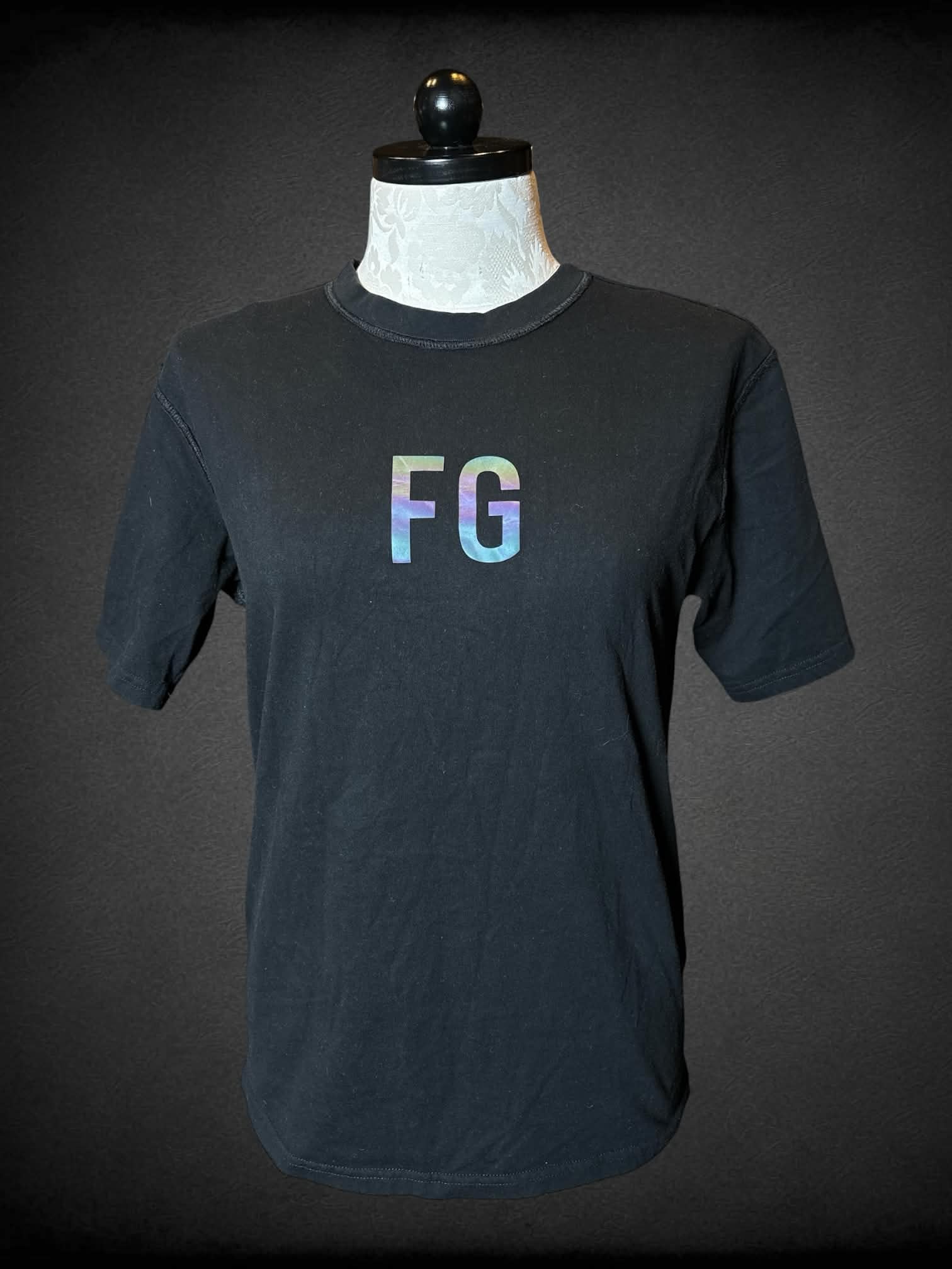1X Fear of God designer black t shirt with “FG” writing on front