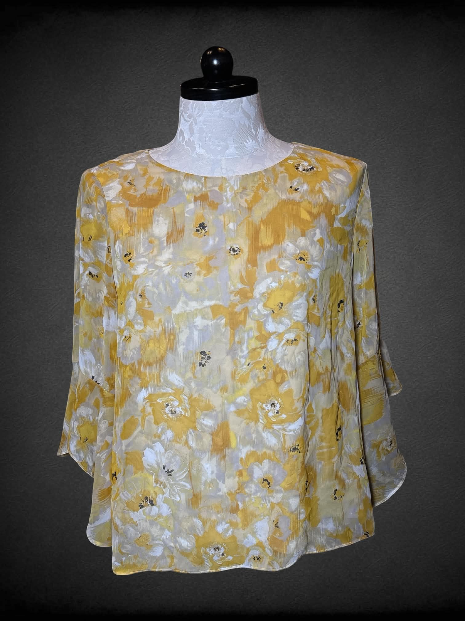 1X Kasper flowy yellow blouse with floral design, bell sleeves, and button on back