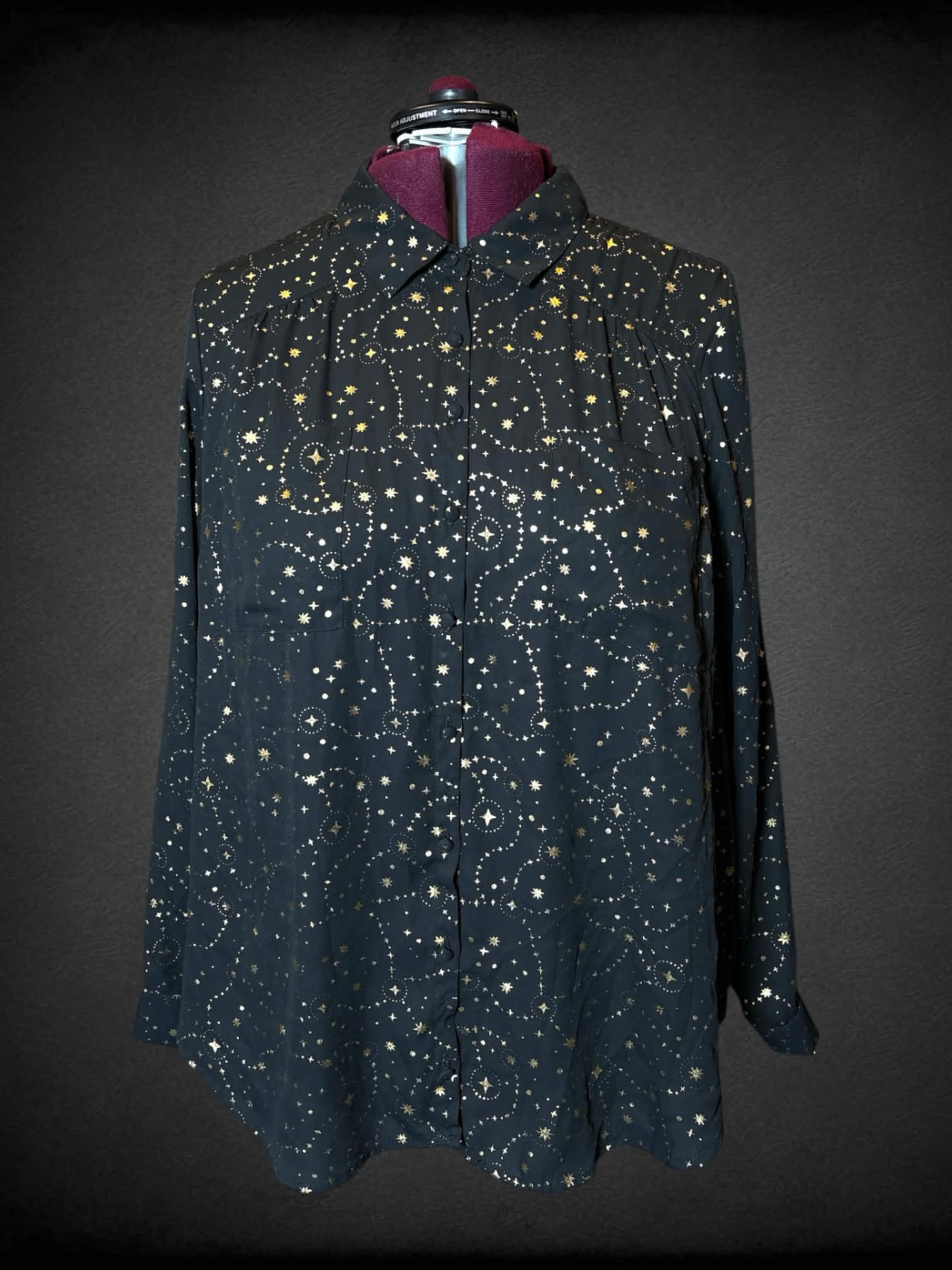 3X Torrid black button-up shirt with gold star pattern, and pockets on front