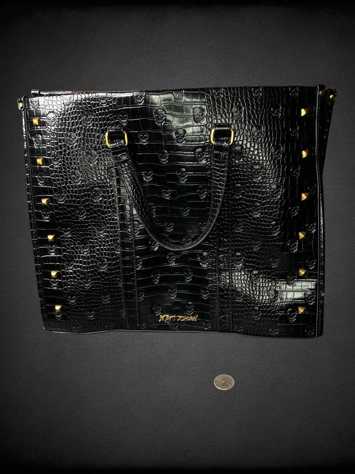 Betsey Johnson black skull Croc-embossed faux leather hand bag with zipper pockets, and gold studded detailing