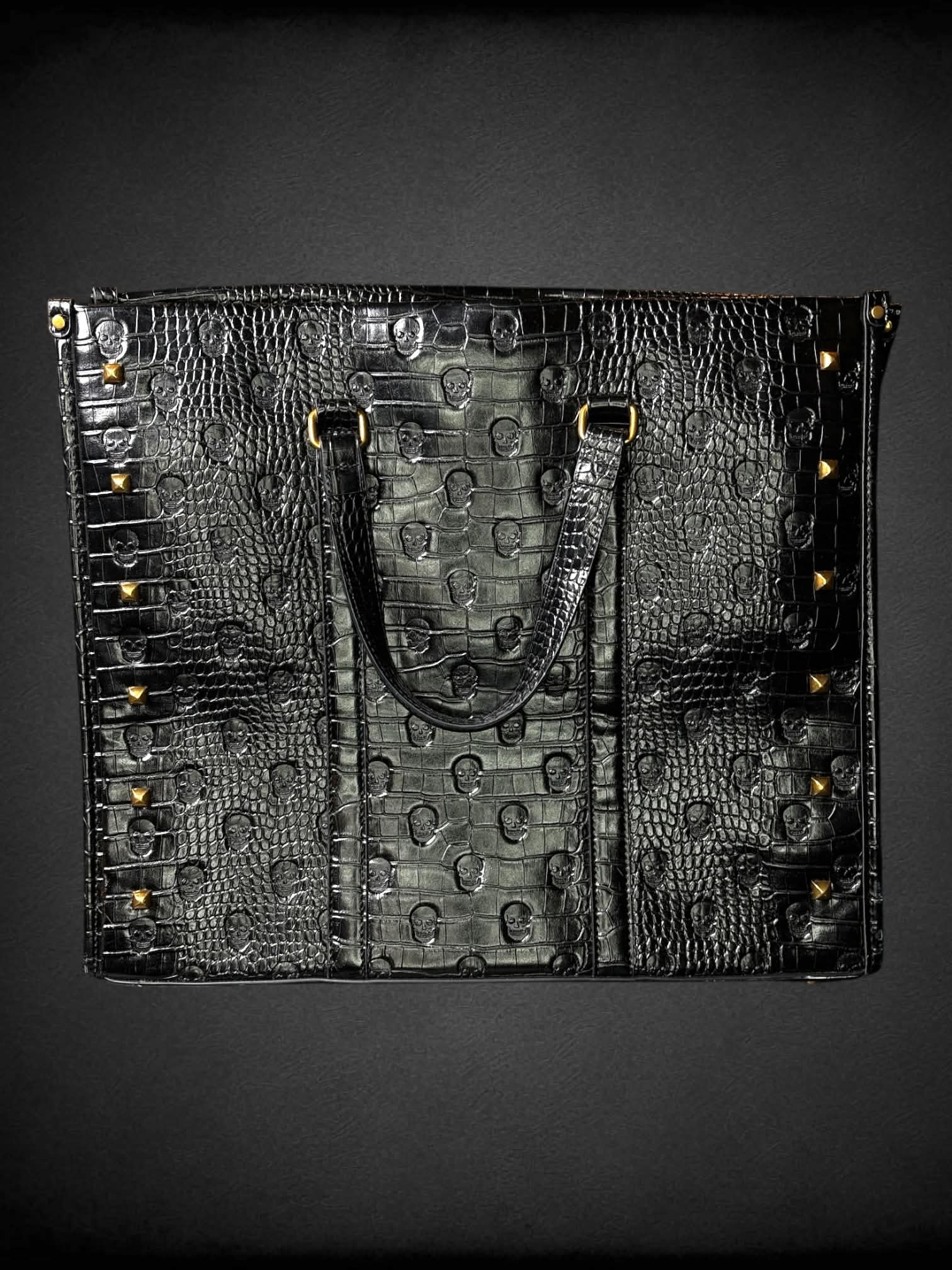 Betsey Johnson black skull Croc-embossed faux leather hand bag with zipper pockets, and gold studded detailing