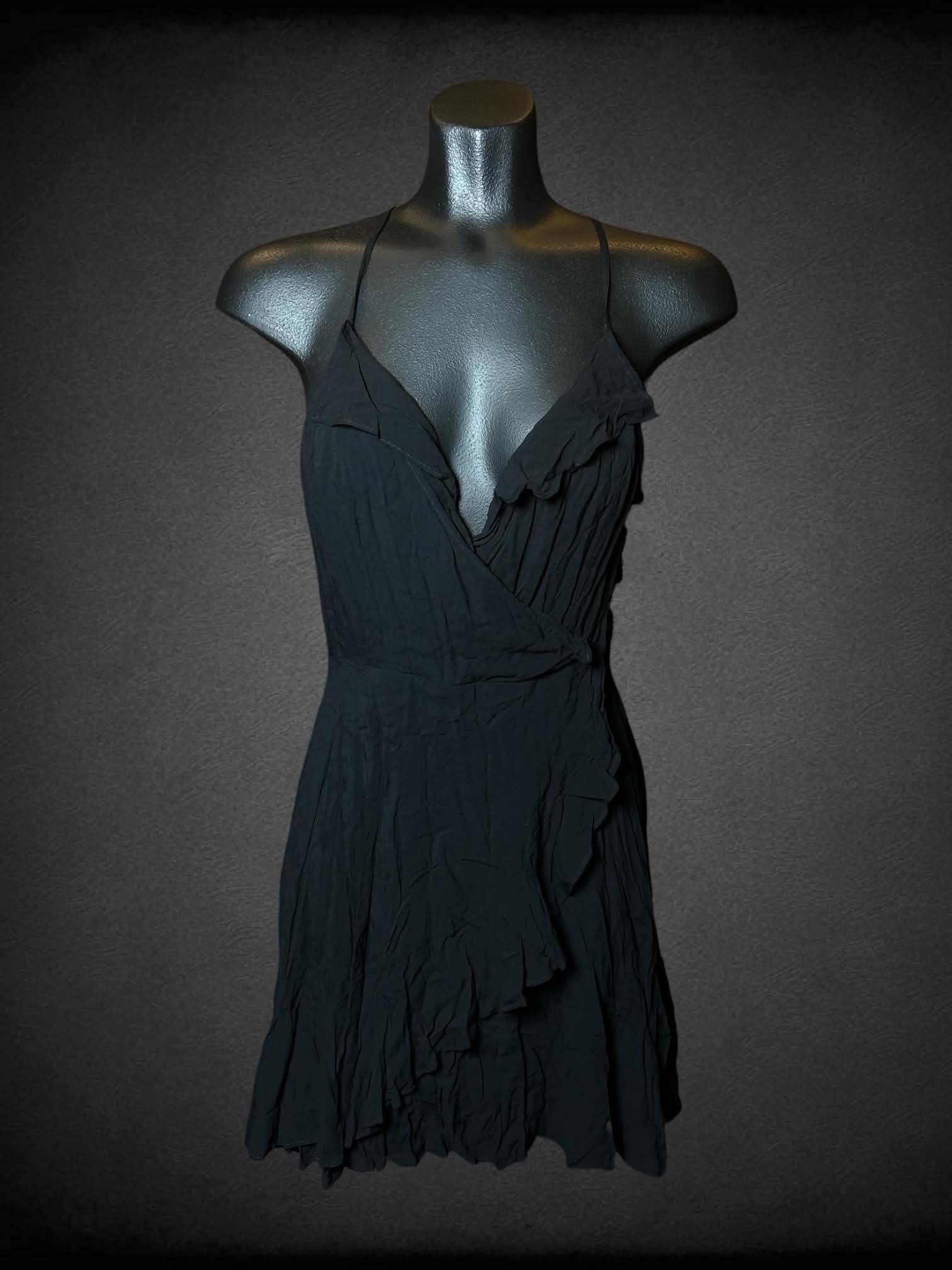 S Kimchi Blue black short dress with asymmetrical wrap-around design, zipper on side, and lace up cutout on back