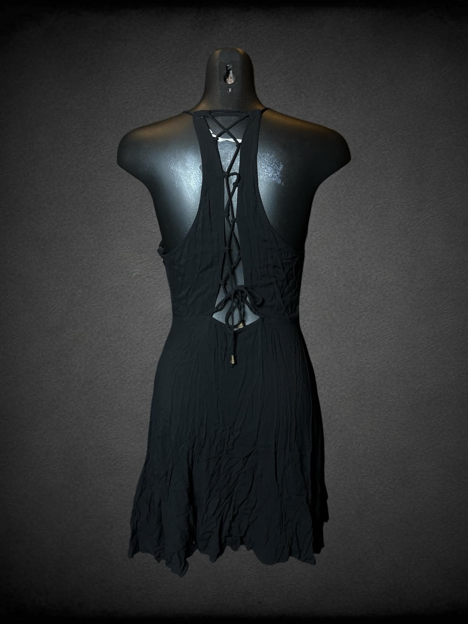 S Kimchi Blue black short dress with asymmetrical wrap-around design, zipper on side, and lace up cutout on back