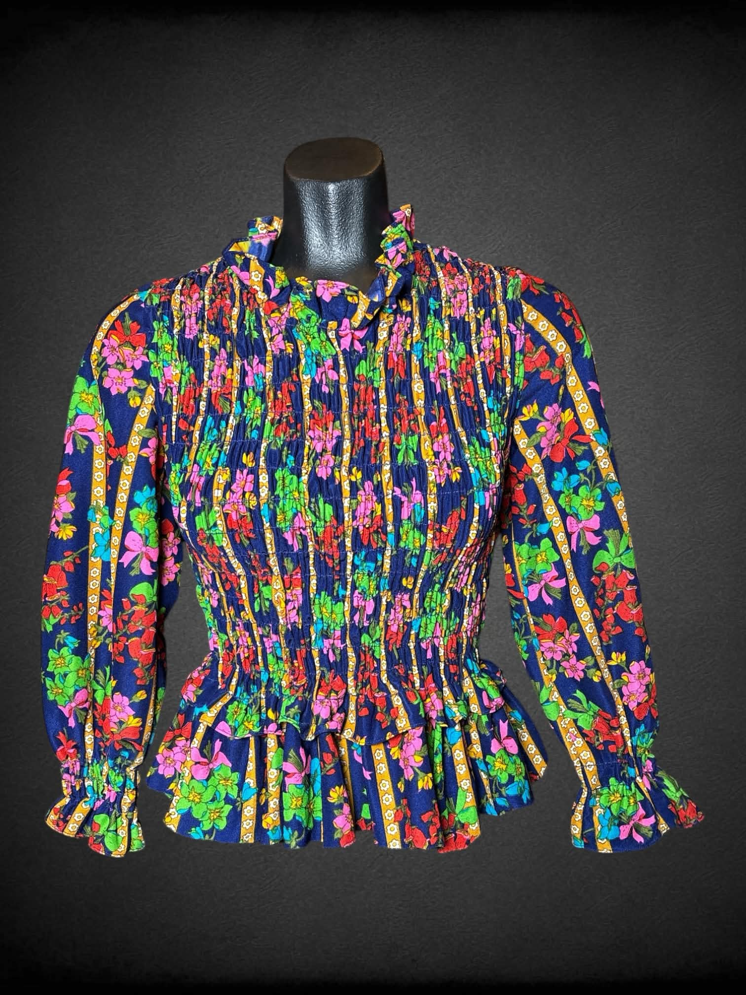 M Elen Henderson vintage navy blue long-sleeve blouse, with shirred top, ruffle hem, and bouquet pattern