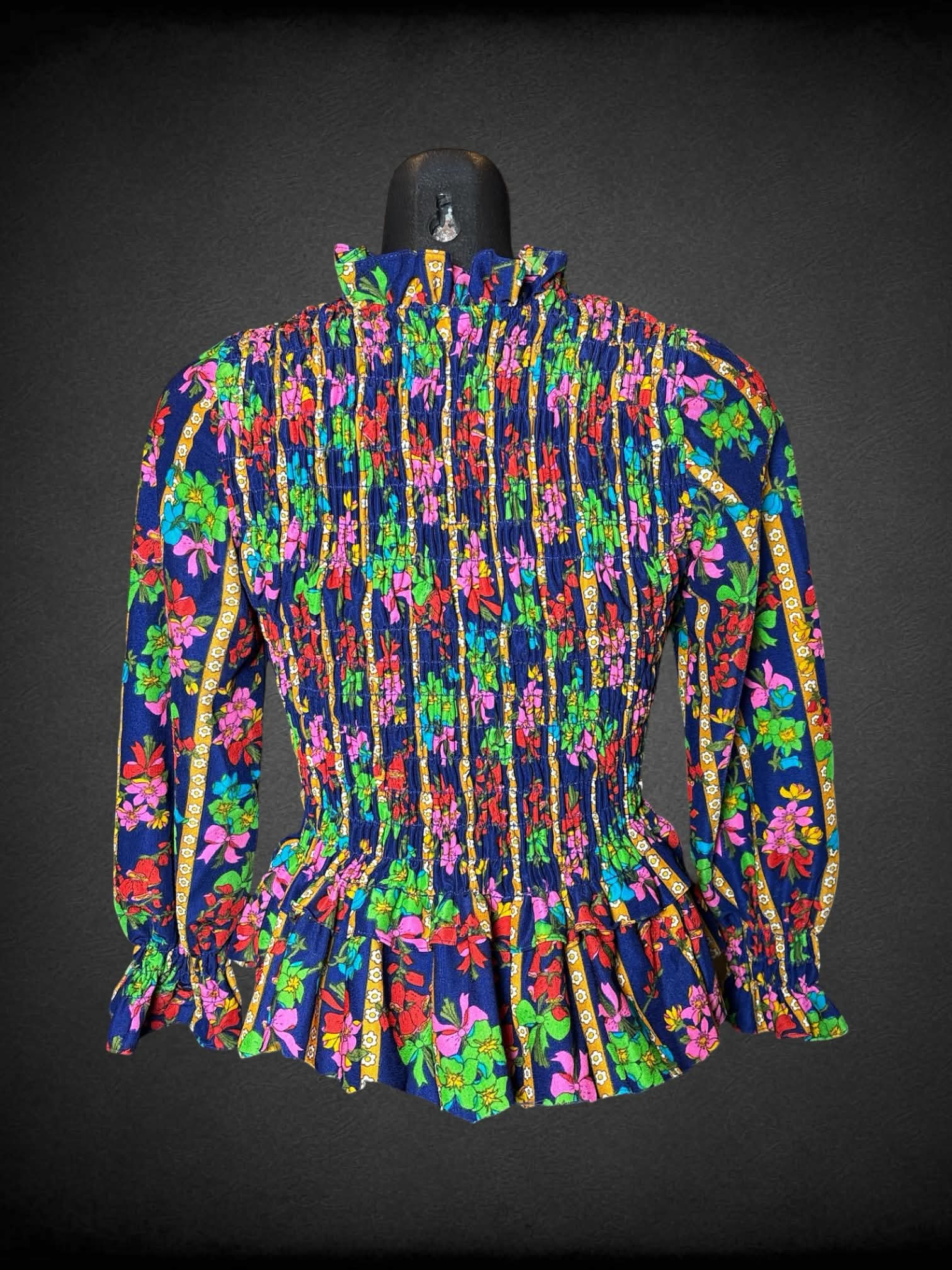 M Elen Henderson vintage navy blue long-sleeve blouse, with shirred top, ruffle hem, and bouquet pattern