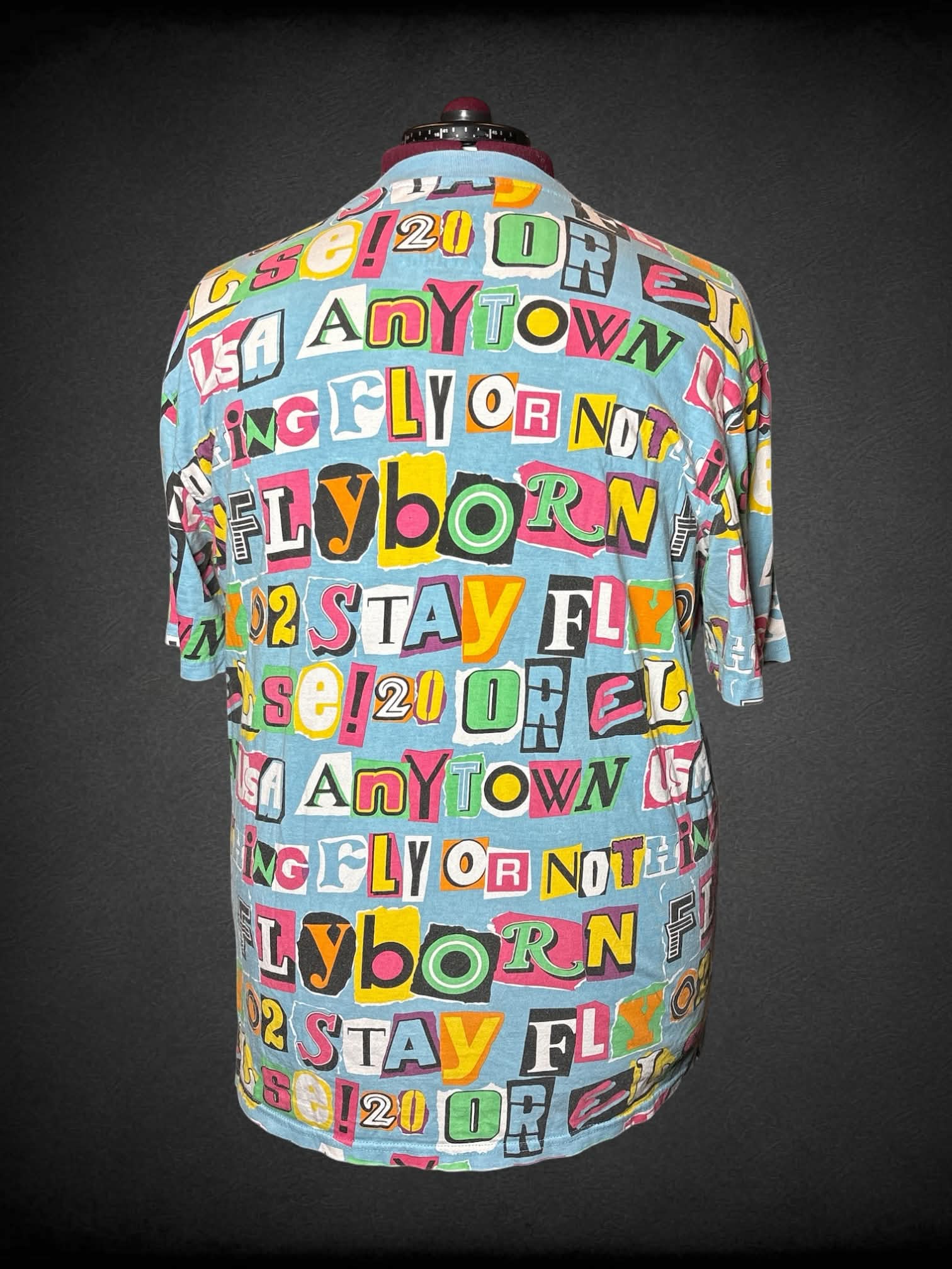 3X Born Fly light blue t shirt with wording graphic on front and back, and embroidered “Born Fly” on front