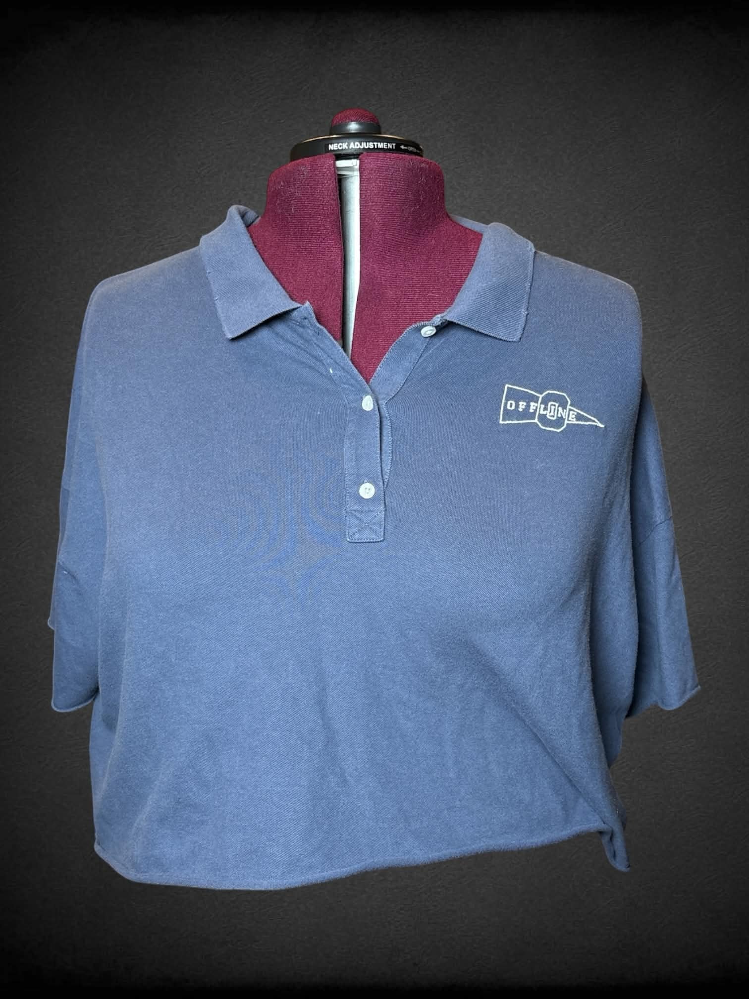 3X Offline soft blue/grey cropped polo shirt with embroidered “Offline” logo on front