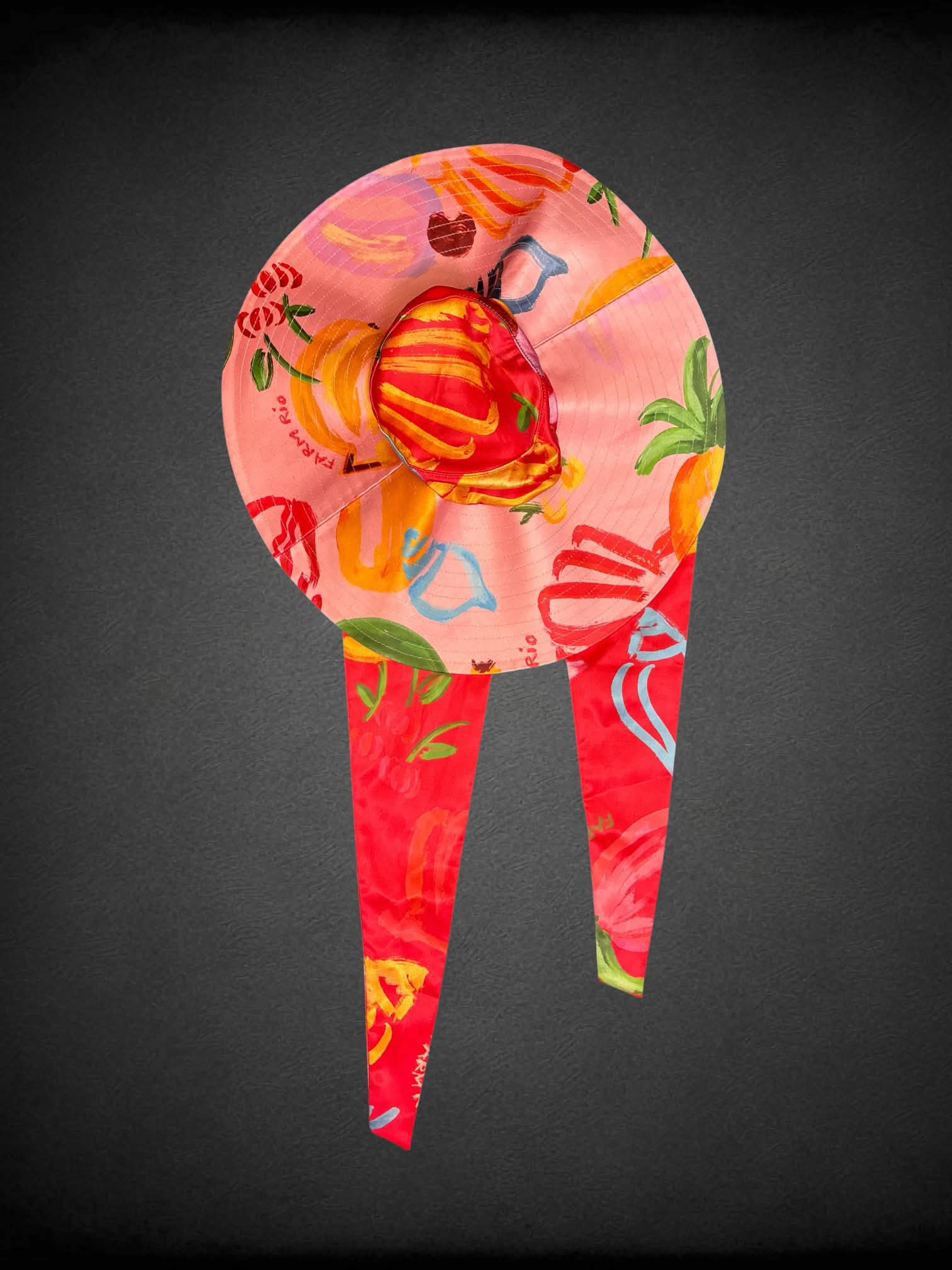 Farm Rio pink wide-brimmed sunhat with tropical fruit pattern, and under chin tie
