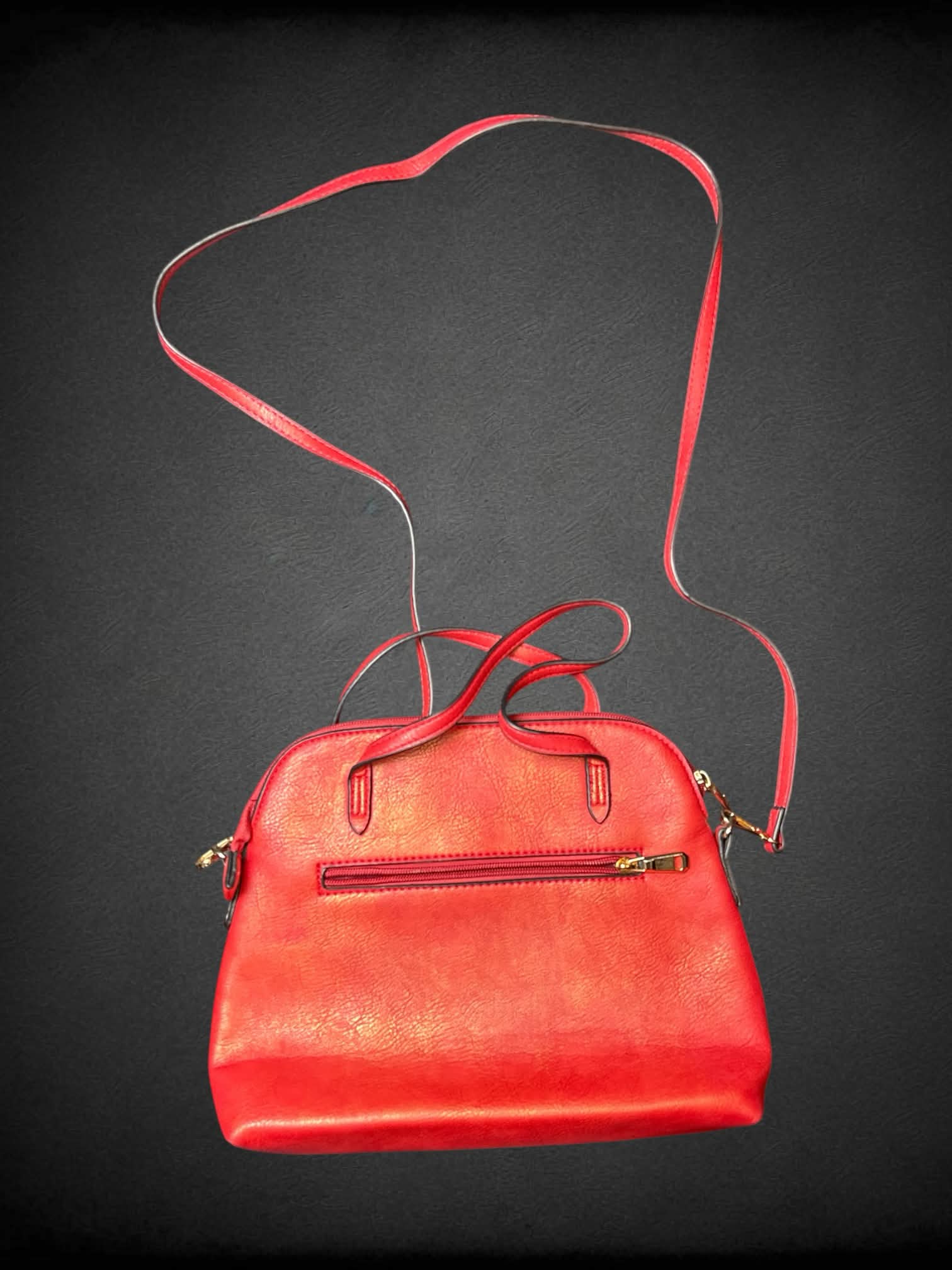 Red faux leather shoulder bag with hand-painted “Boss Up” writing on front
