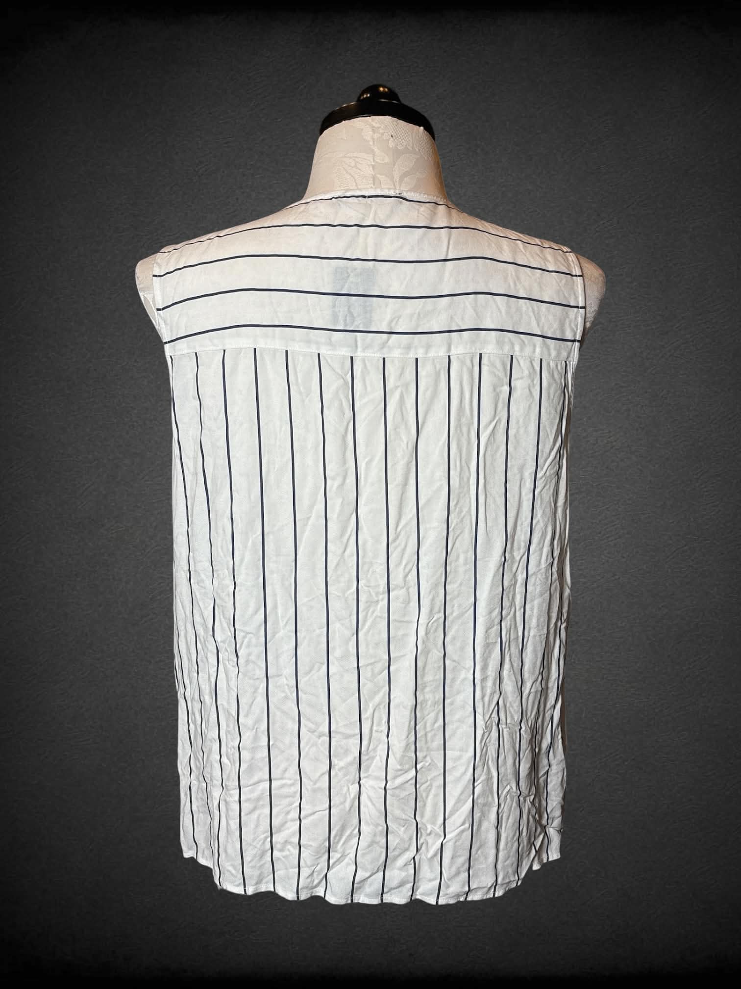 1X LC Waikiki white sleeveless button-up shirt with blue striped design, and pocket on front
