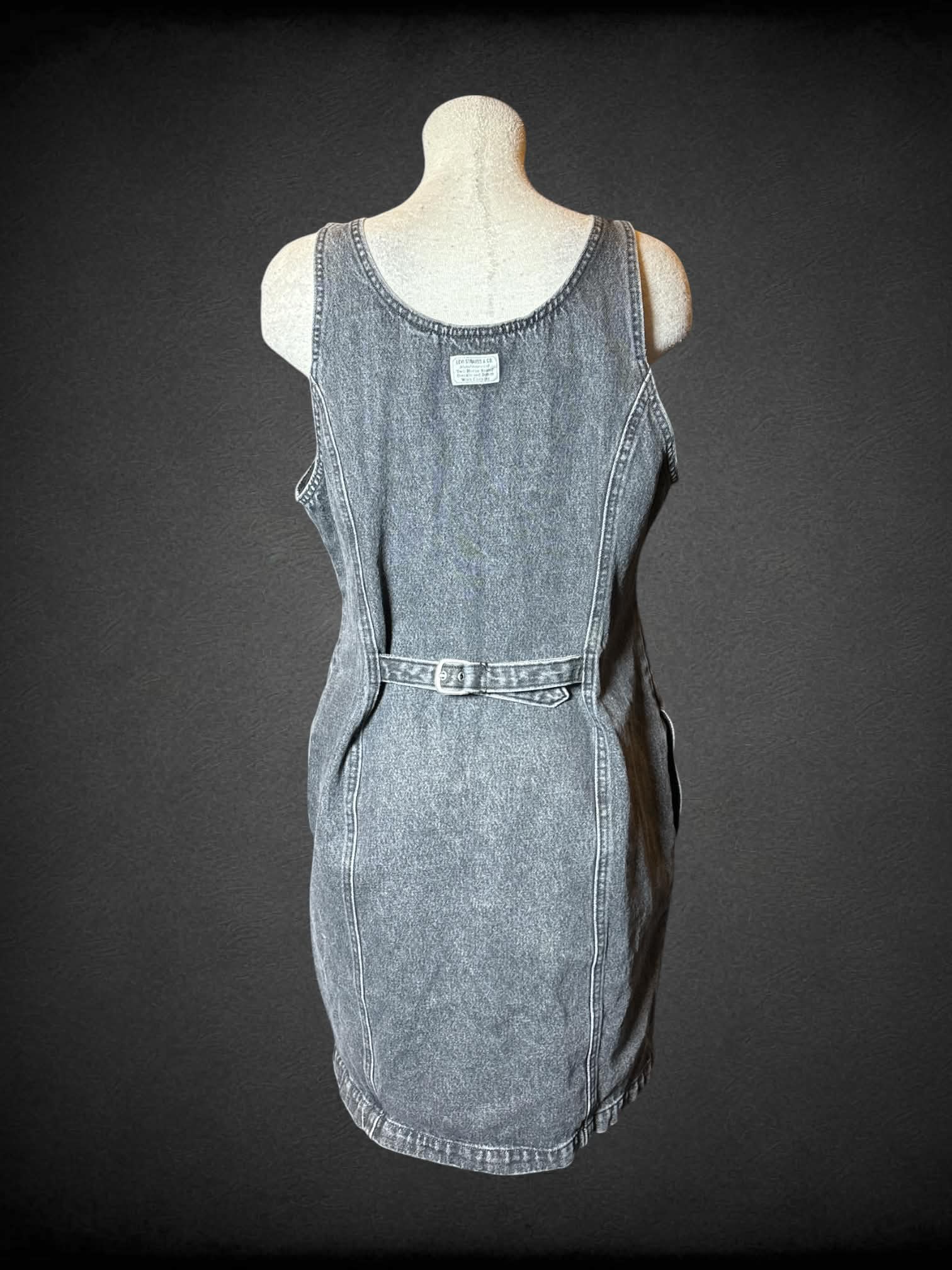 L Levi’s grey denim button-up overall dress with pockets, and adjustable belt tie on back