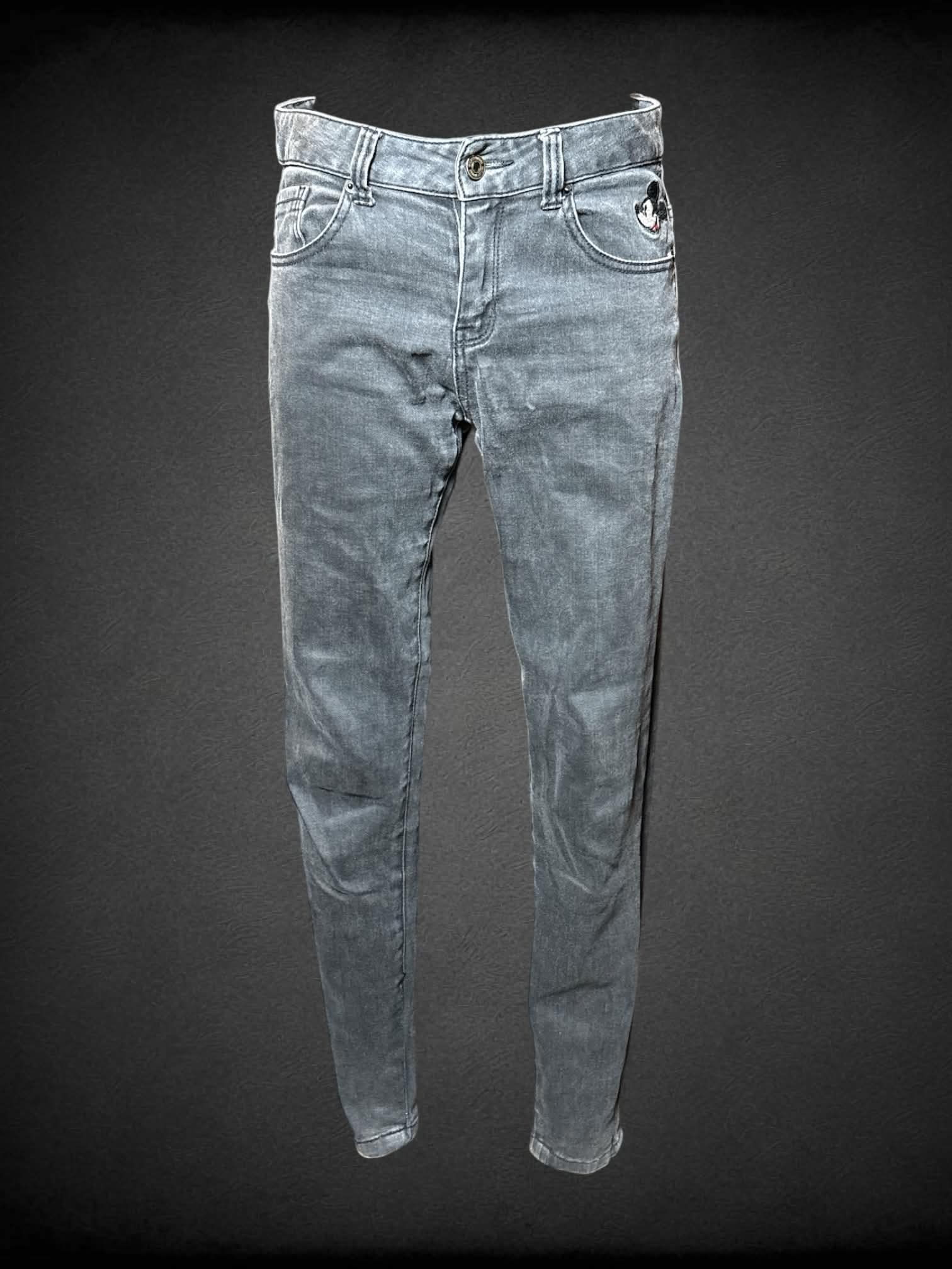 M Disney grey skinny jeans with embroidered “Mickey Mouse” graphic on front pocket, and writing on back pocket