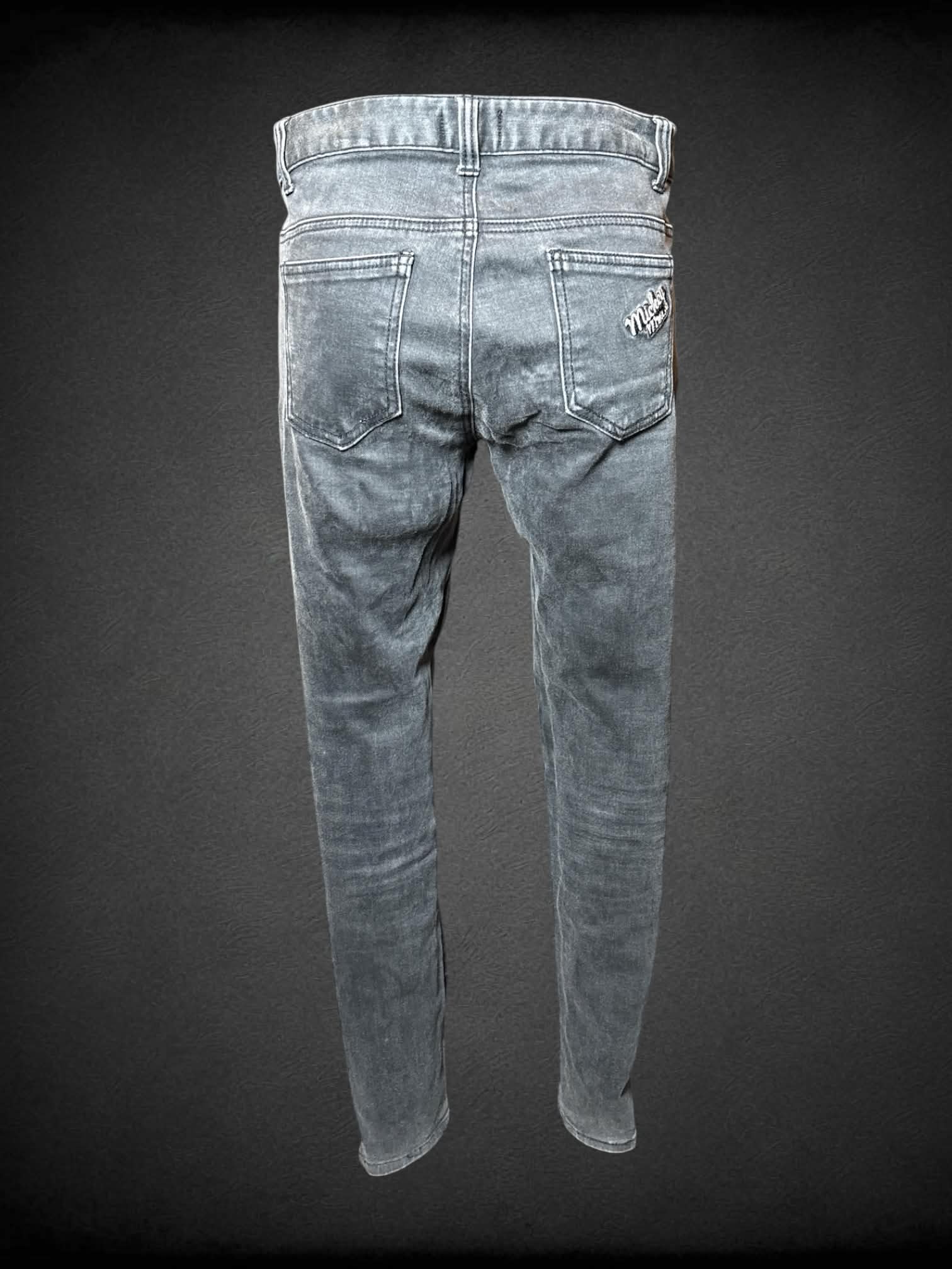 M Disney grey skinny jeans with embroidered “Mickey Mouse” graphic on front pocket, and writing on back pocket
