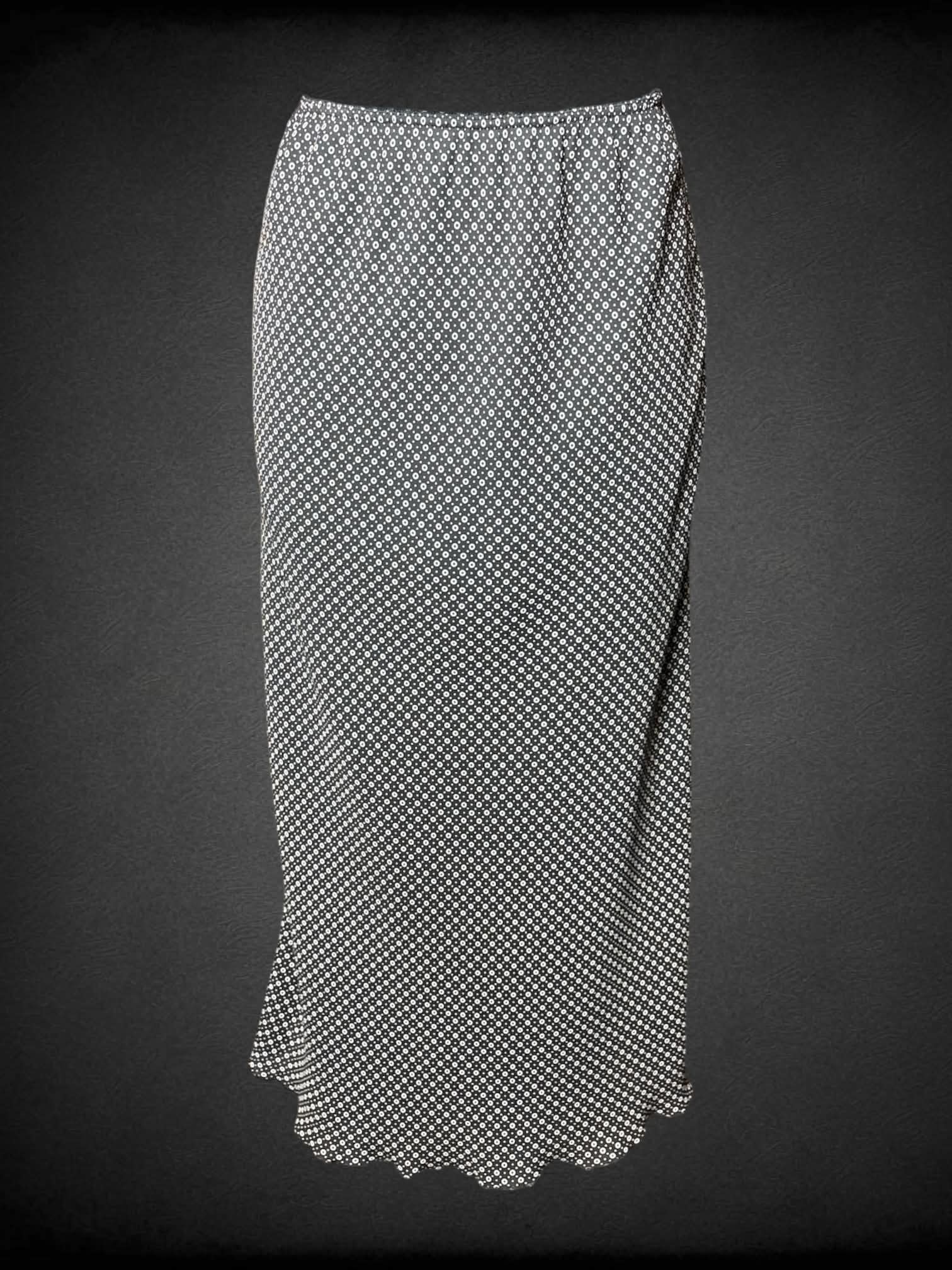 S Norton vintage black skirt with circular pattern, stretch waist and ruffle hem
