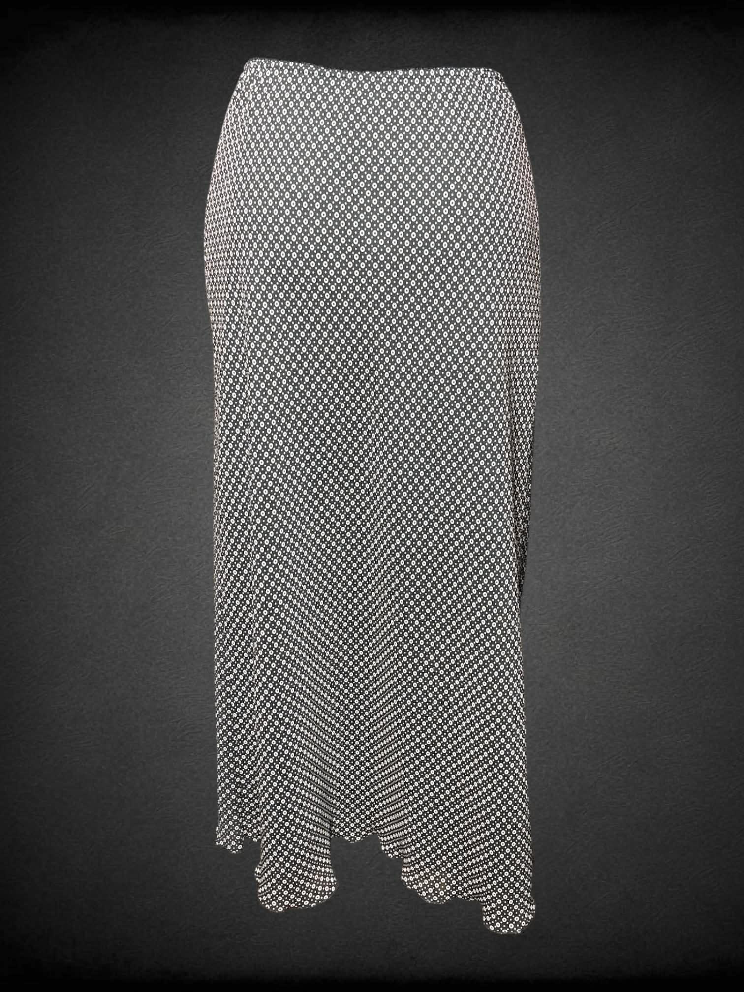 S Norton vintage black skirt with circular pattern, stretch waist and ruffle hem