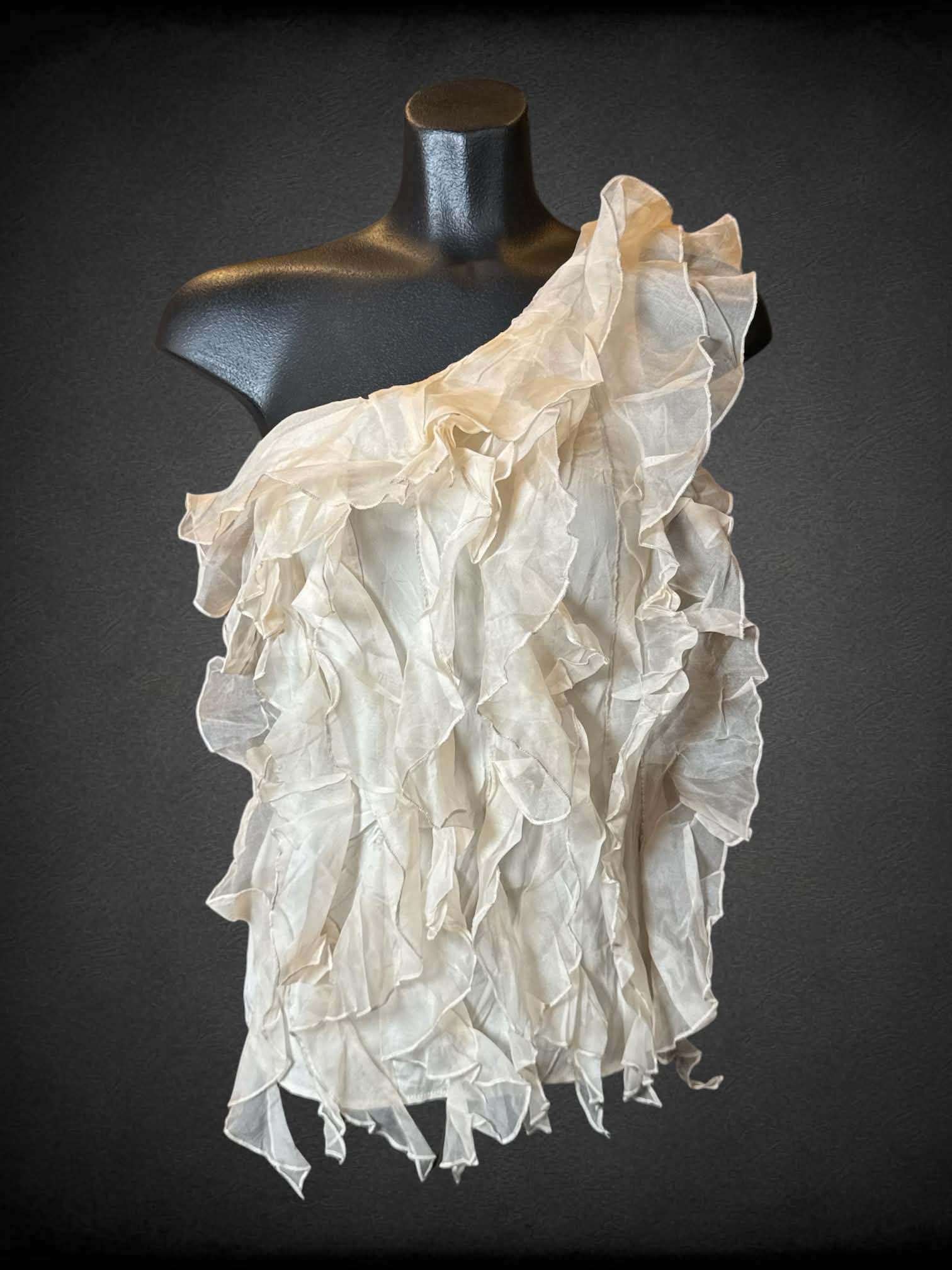 S Bebe beige one-shoulder top with layered ruffle design on front, and zipper on side