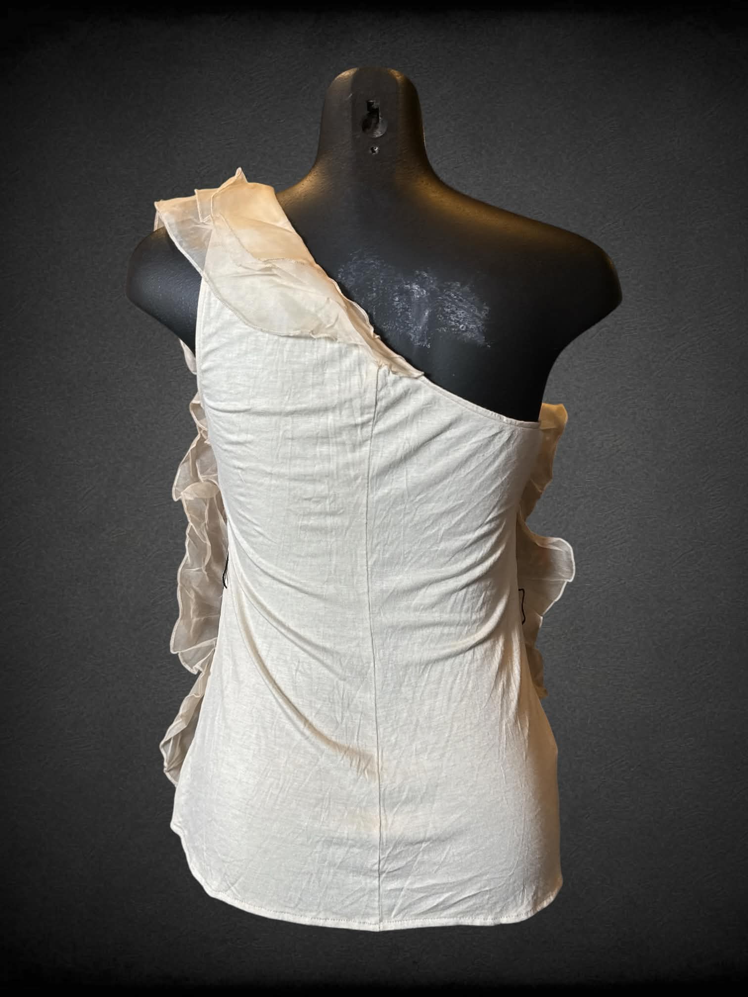S Bebe beige one-shoulder top with layered ruffle design on front, and zipper on side