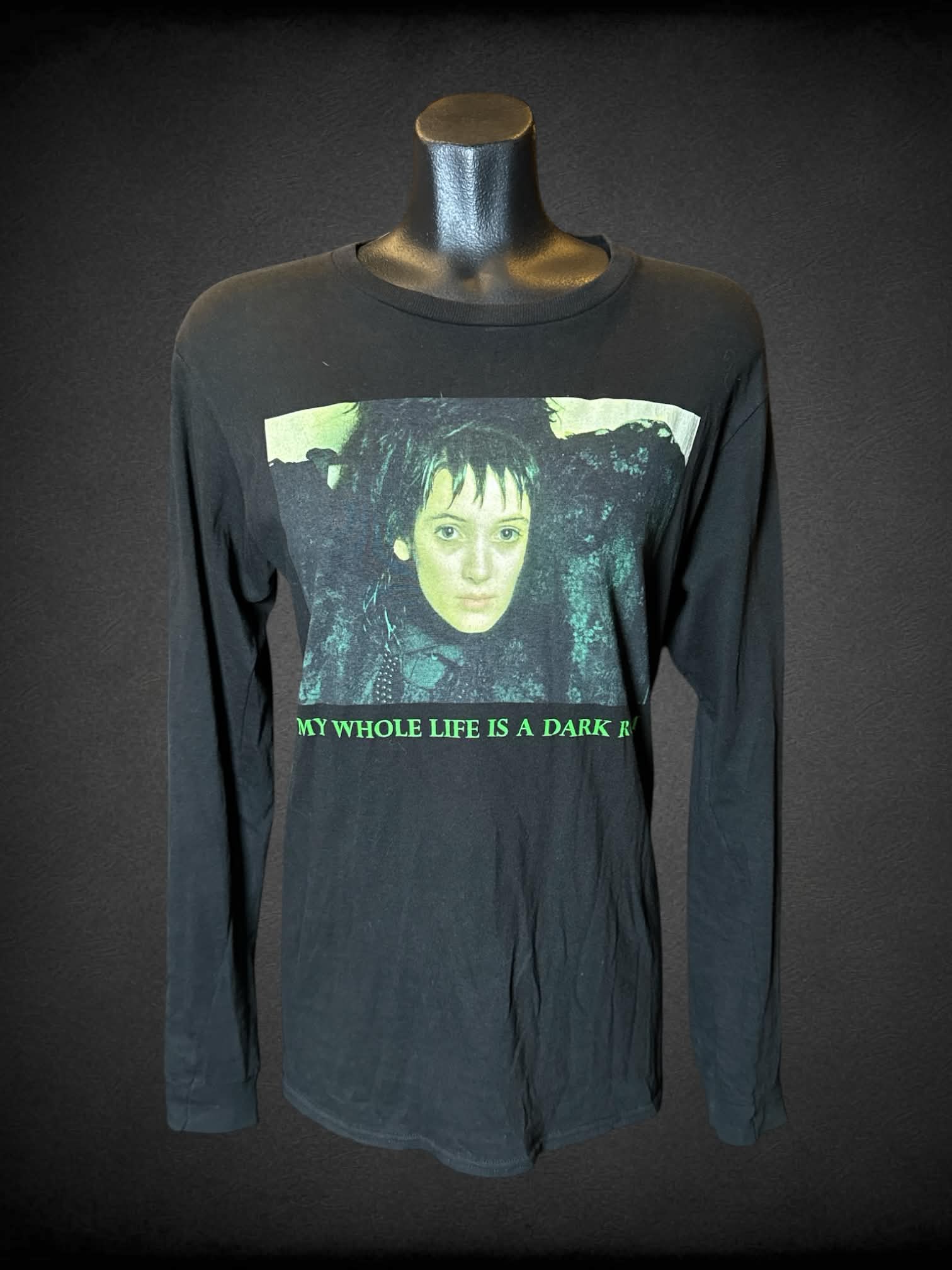 M BeetleJuice black long-sleeve t shirt with Lydia Deetz graphic on front and “one big dark room” writing on sleeve from the movie “BeetleJuice”
