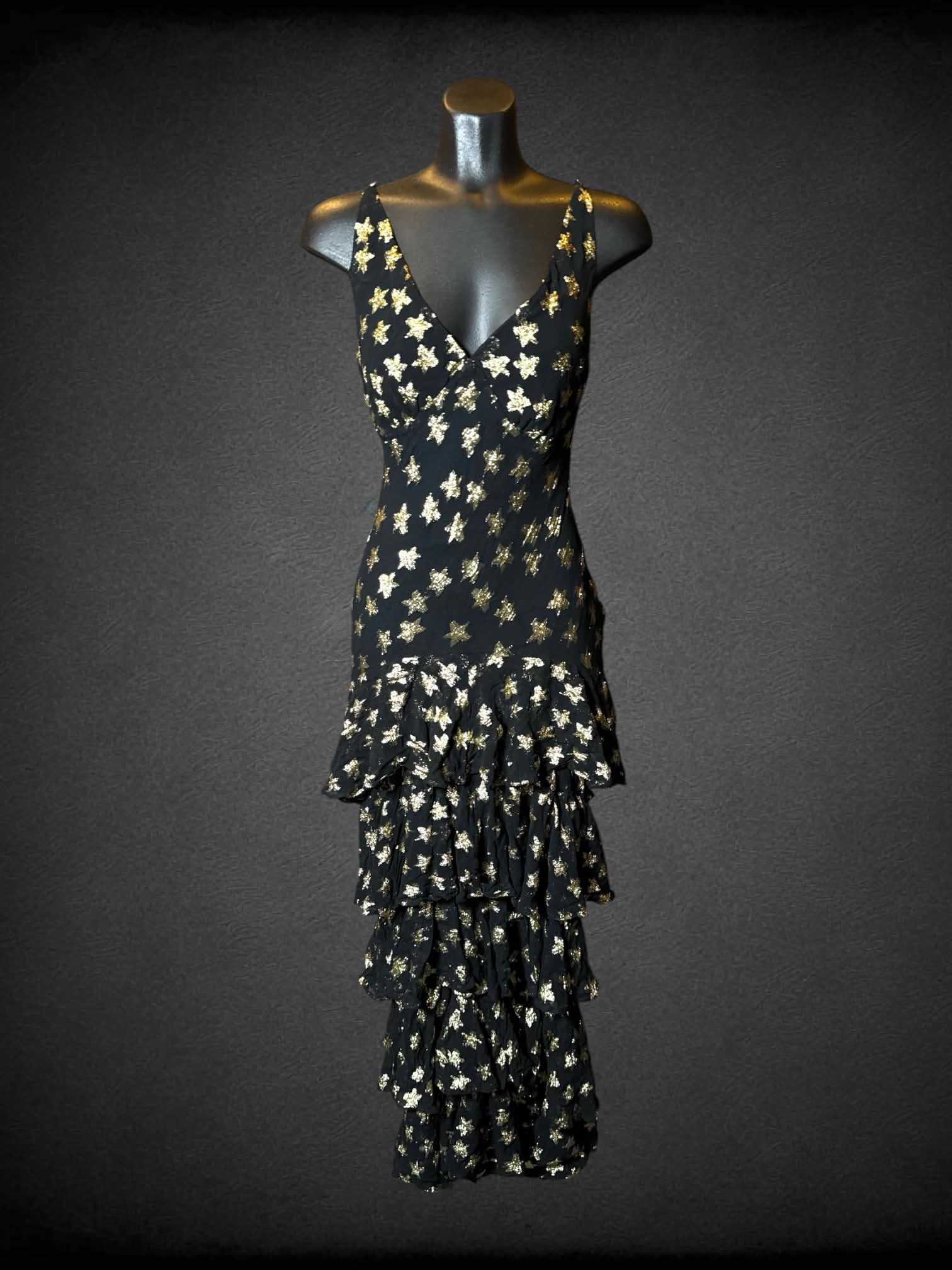 M Nasty Gal black dress with gold star pattern, layered ruffle skirt, adjustable straps, and zipper on back