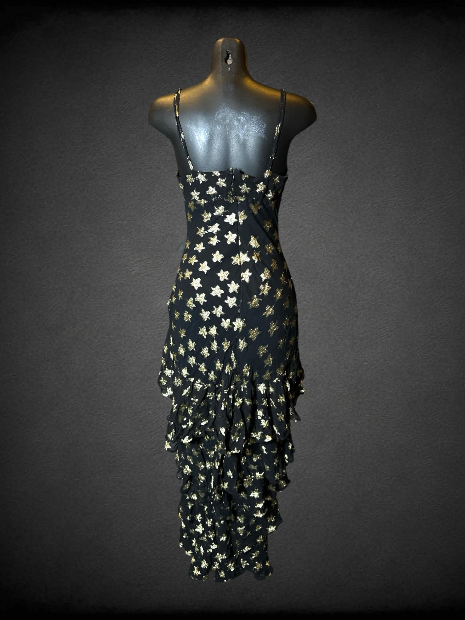 M Nasty Gal black dress with gold star pattern, layered ruffle skirt, adjustable straps, and zipper on back