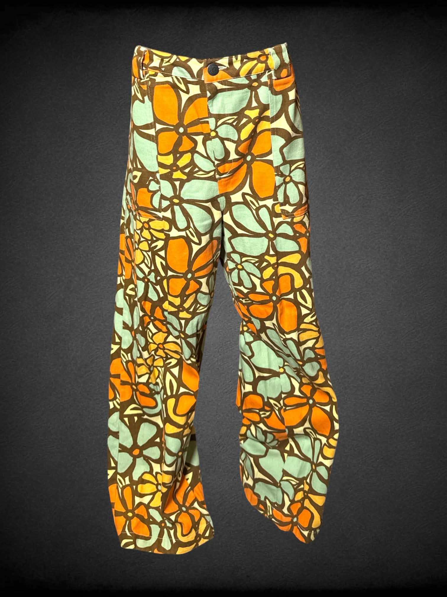 L Lucy & Yak yellow high-waisted pants with 70’s style orange & green floral pattern