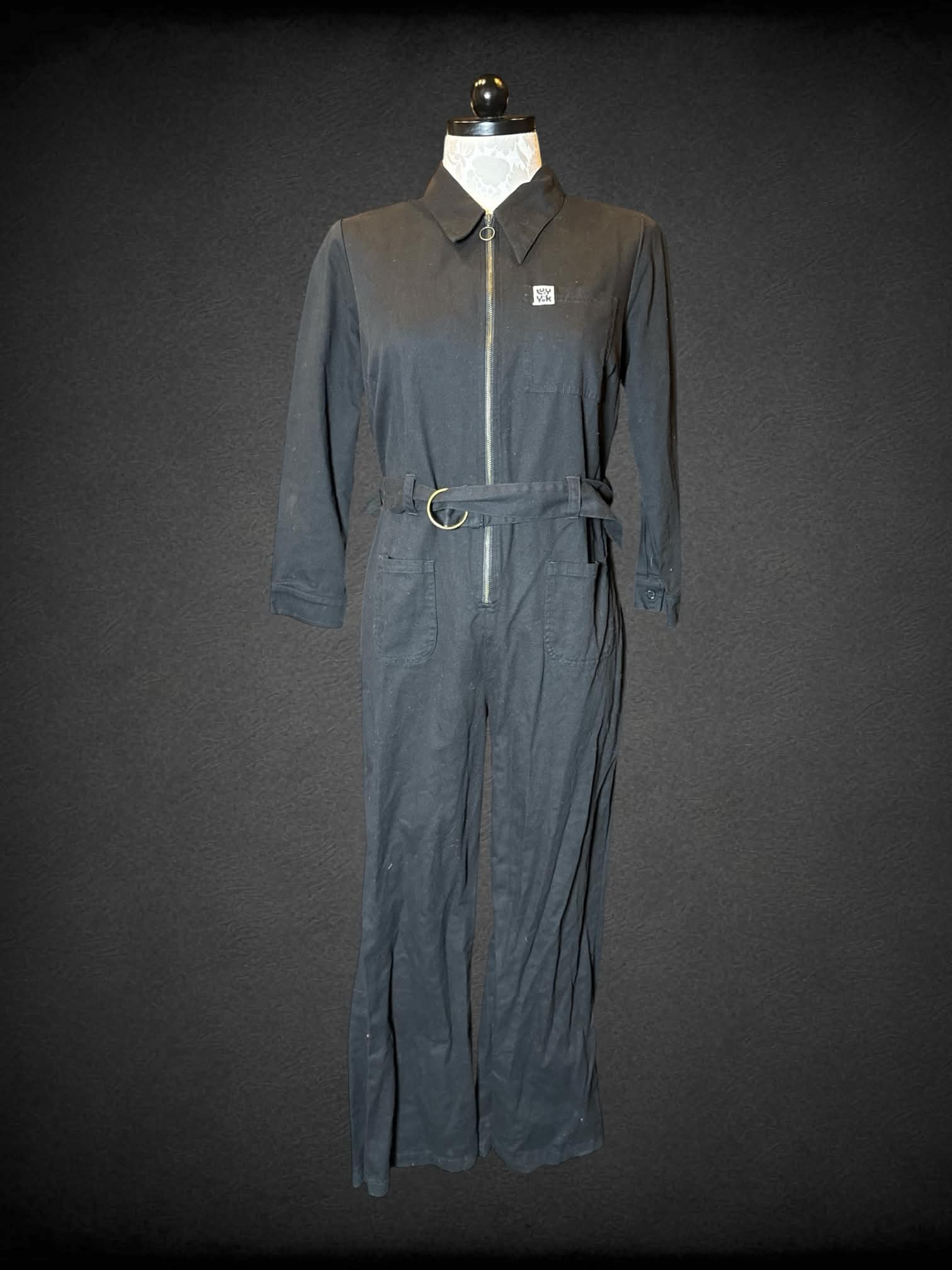 0X Lucy & Yak black long-sleeve jumpsuit with zipper on front, and belt on waist