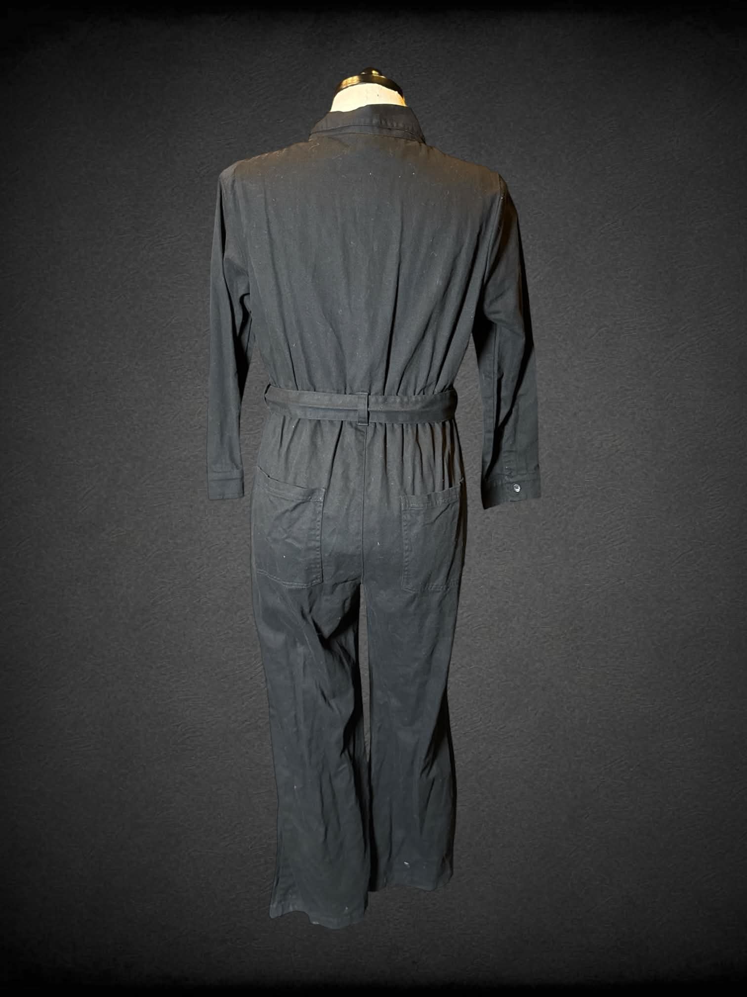 0X Lucy & Yak black long-sleeve jumpsuit with zipper on front, and belt on waist
