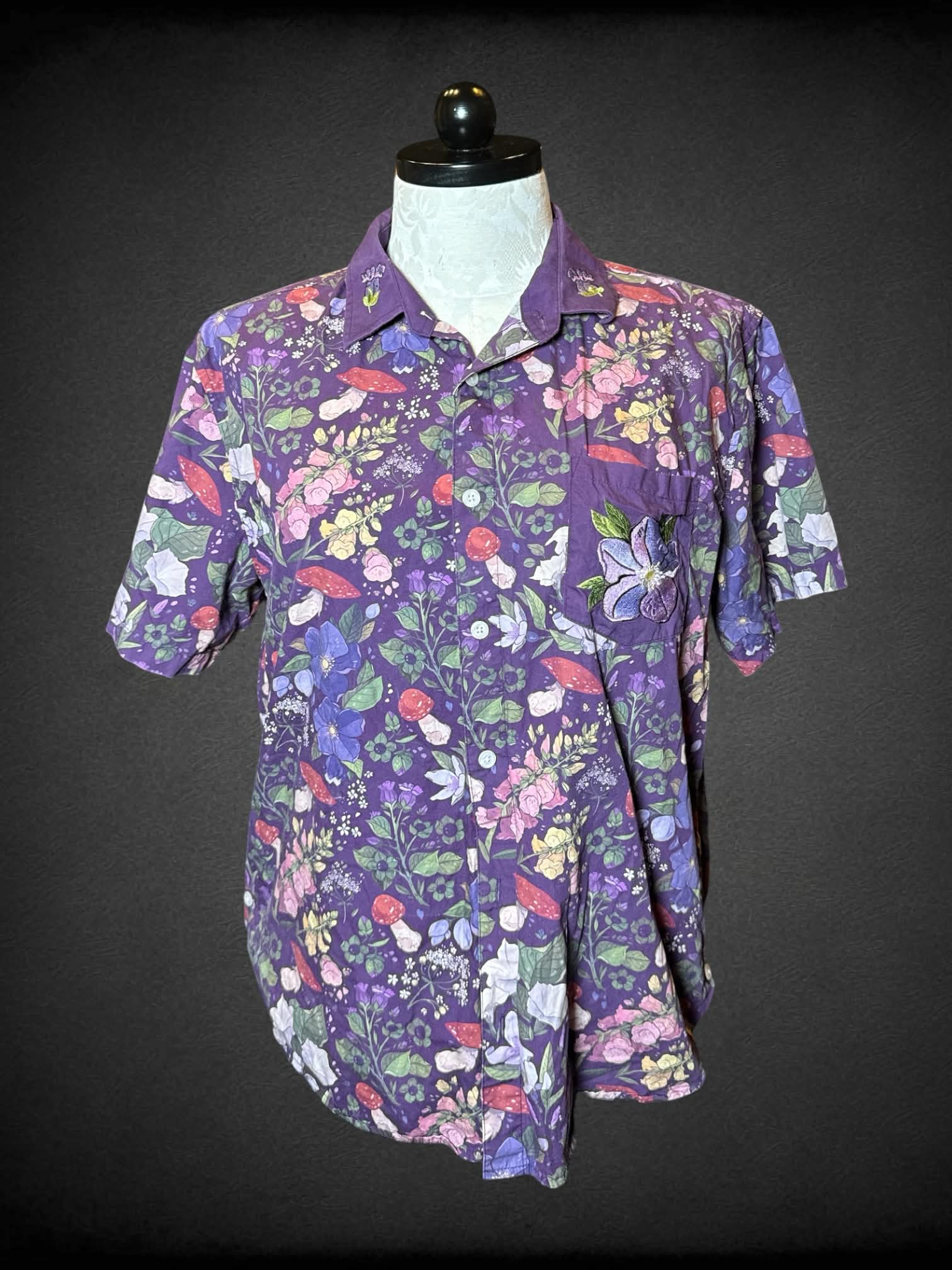1X Morning Witch purple button-up shirt with flower and mushroom pattern, and embroidered flower on pocket and collar