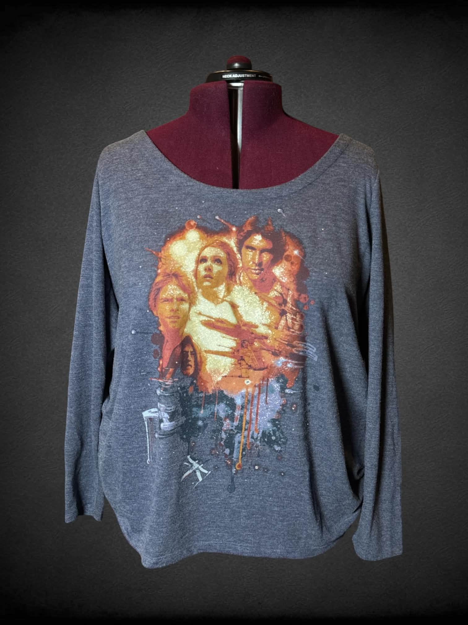 4X Rock & Republic grey sweater top with glittery “Star Wars” graphic on front featuring characters from “A New Hope”, and cutout design on back