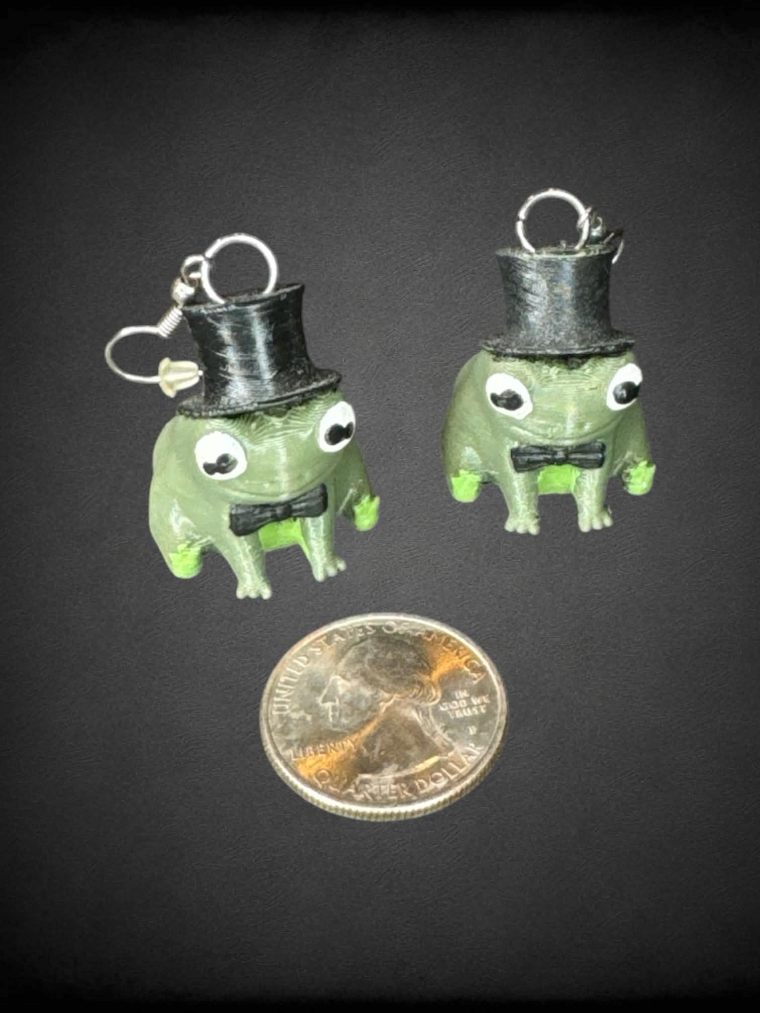 3D printed green frog in top hat earrings