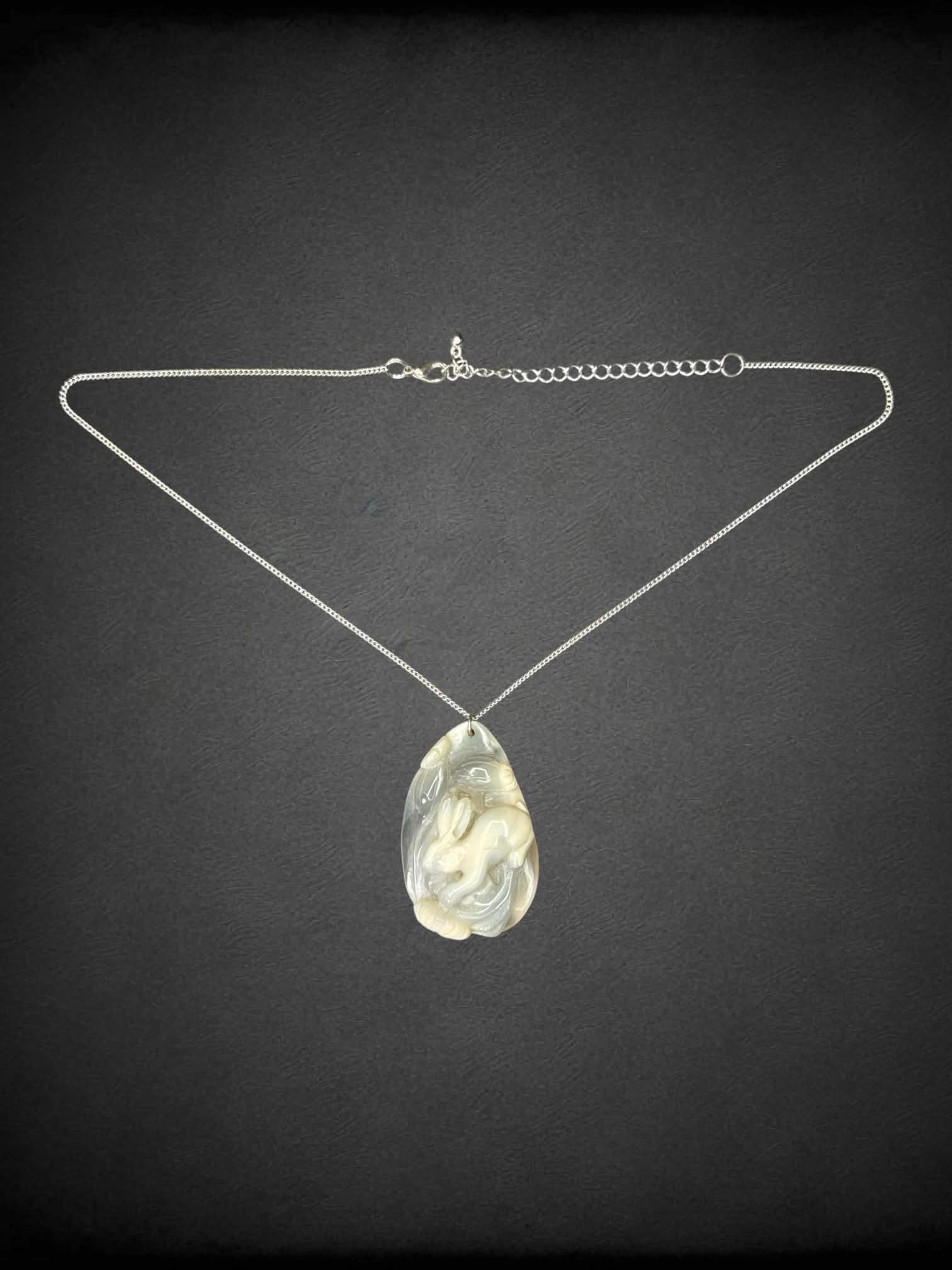 Silver chain necklace with hand-carved bunny stone pendant