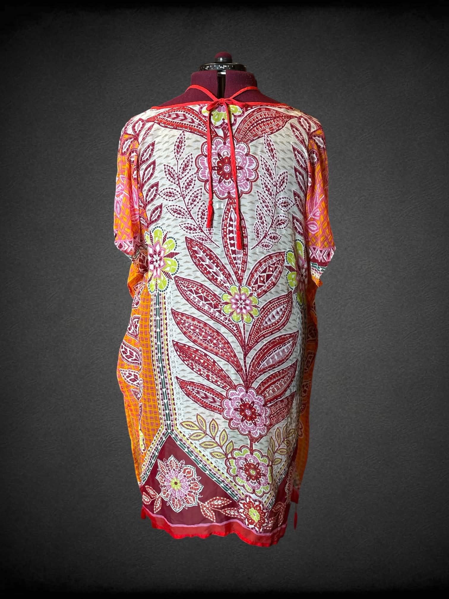 2X white sheer flowy dress with colorful symmetrical floral design, and tassels