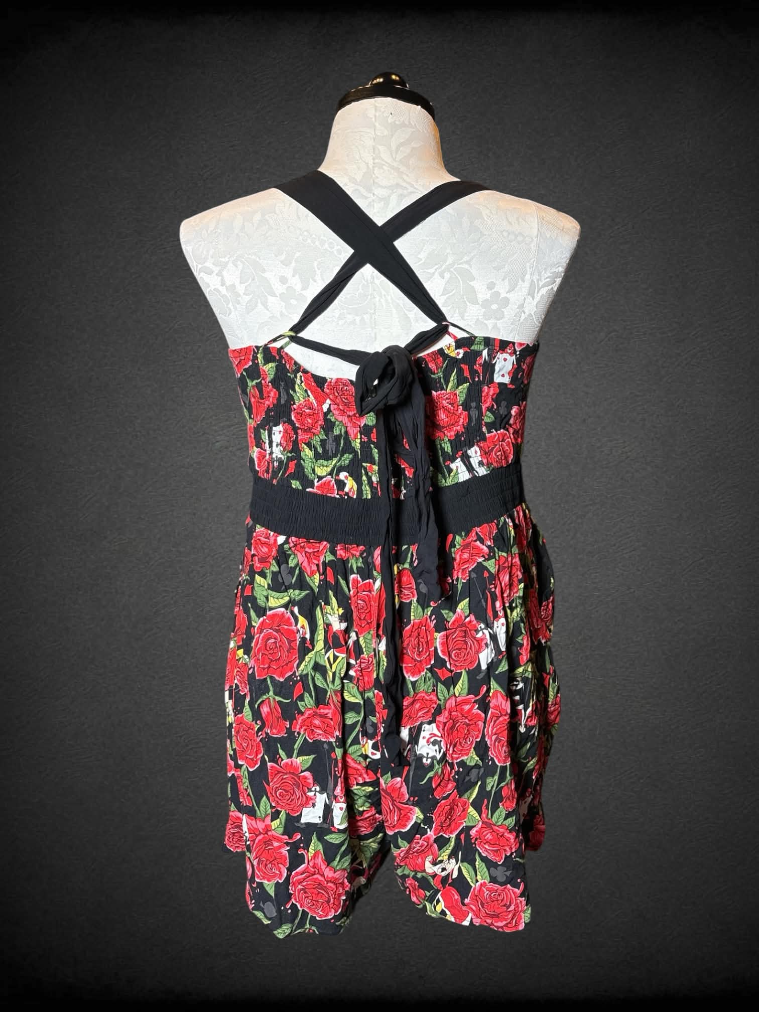 0X Disney Villains black & red jumpsuit with “Alice in Wonderland” red queen and rose pattern, pockets, and cross tie straps on back