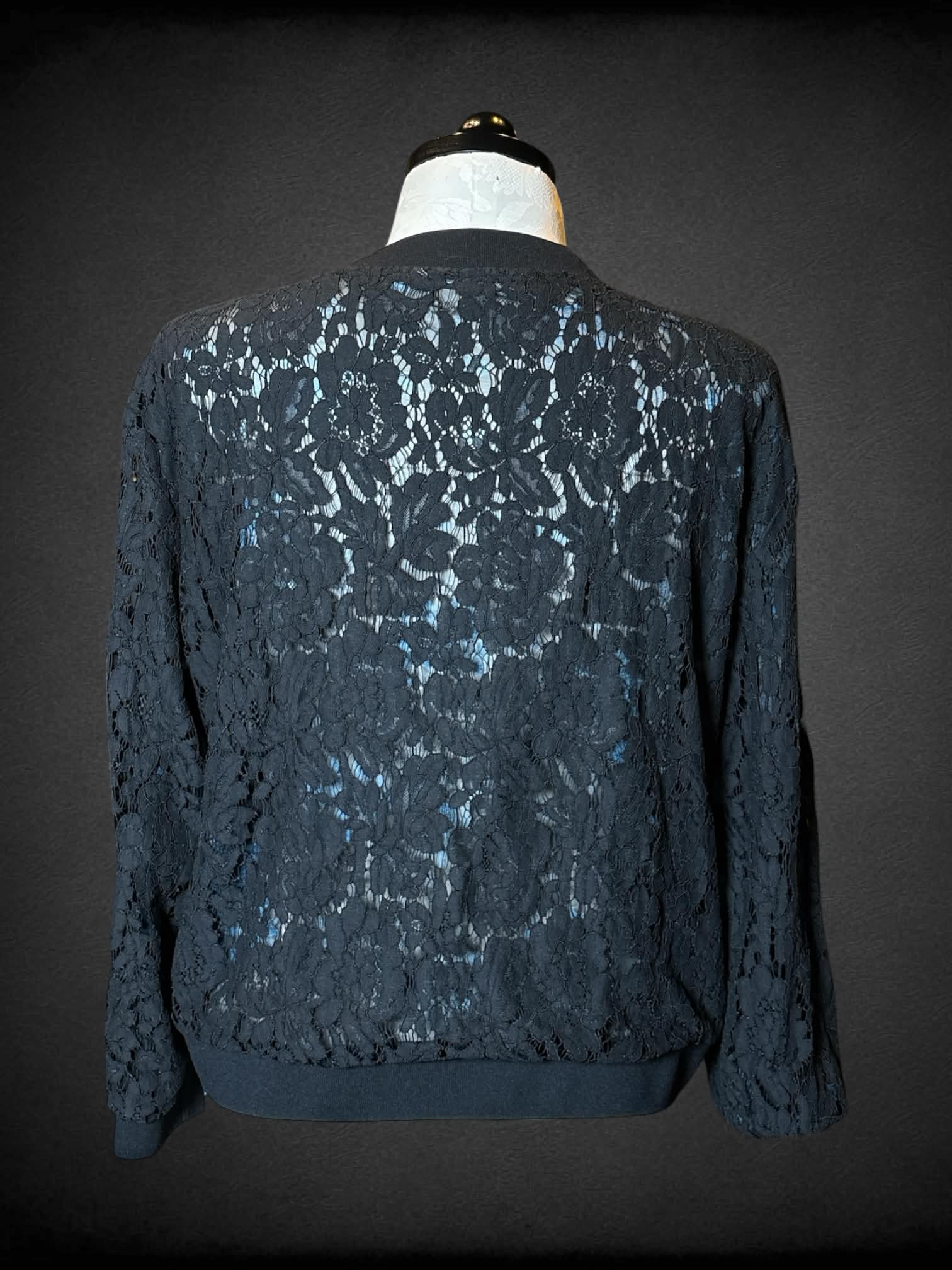 0X reversible black zip-up jacket with black embroidery design, and mesh blue floral design