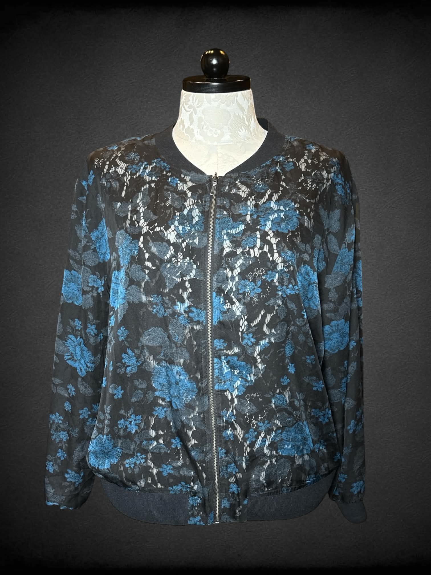 0X reversible black zip-up jacket with black embroidery design, and mesh blue floral design