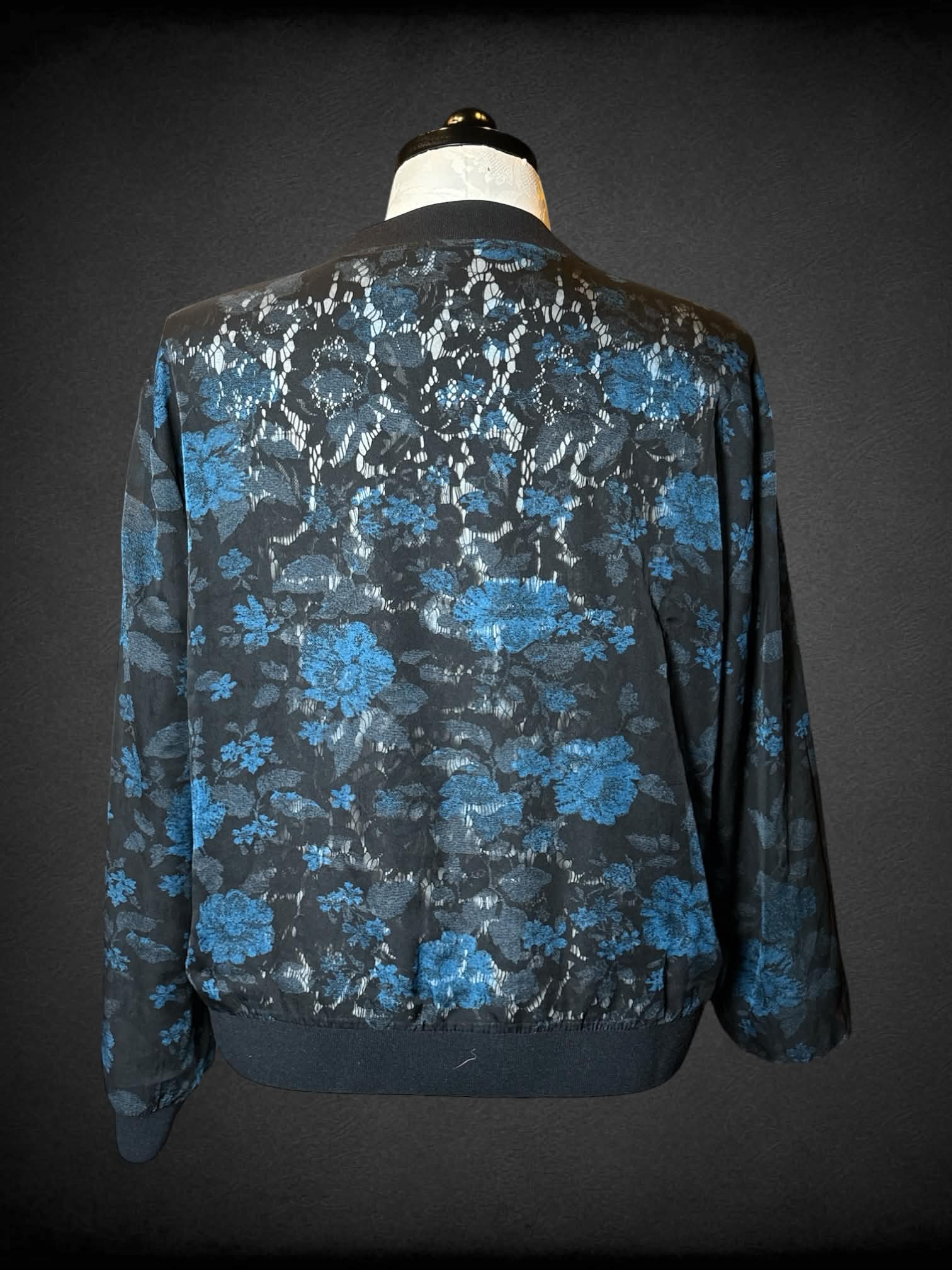 0X reversible black zip-up jacket with black embroidery design, and mesh blue floral design