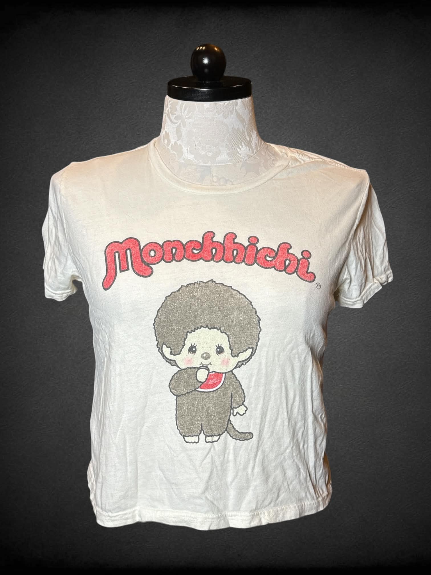 0X Monchhichi white cropped t shirt with “Monchhichi” graphic on front