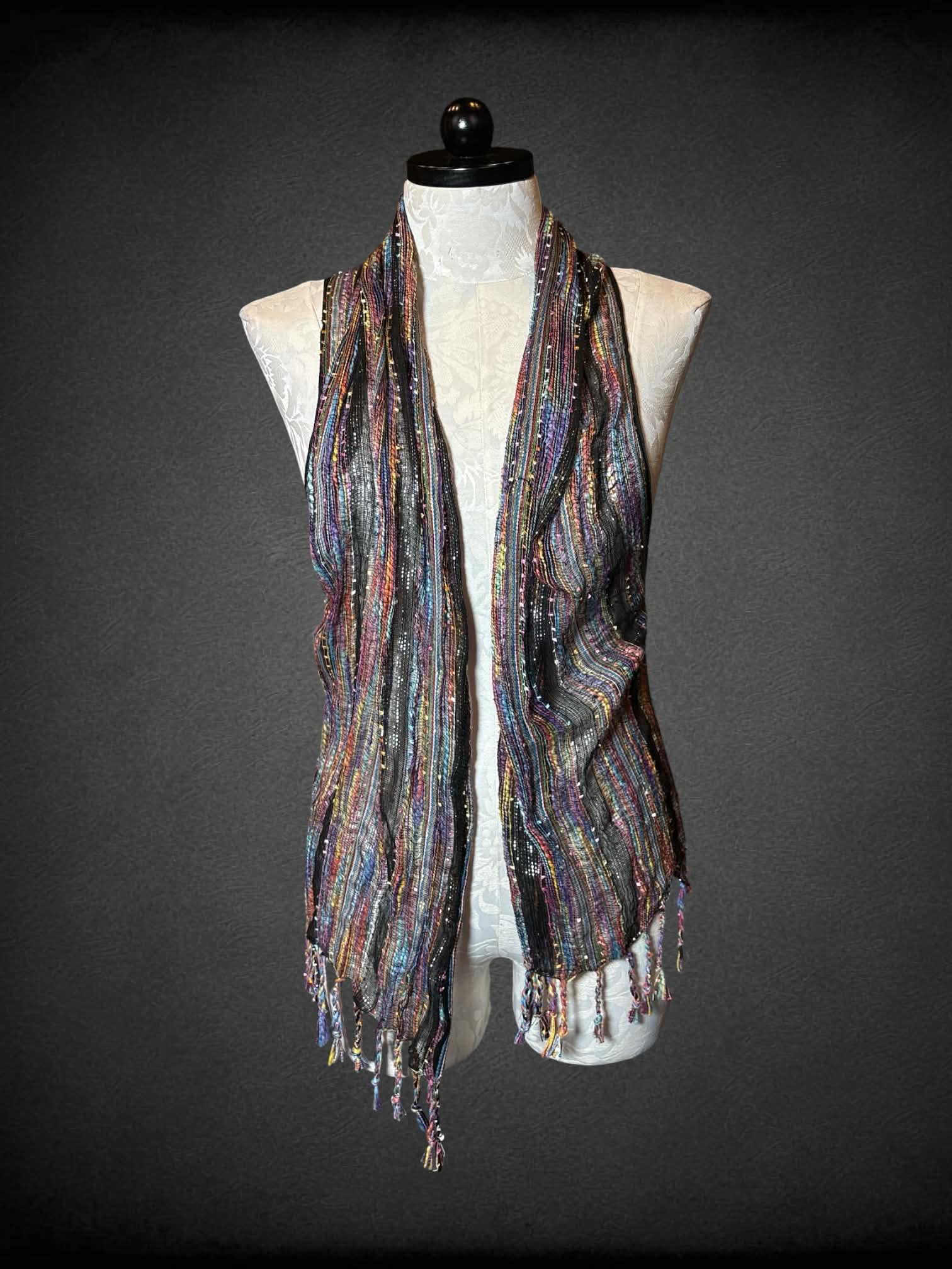 1X colorful woven outer-layer with metallic pattern, and tassels on hemline