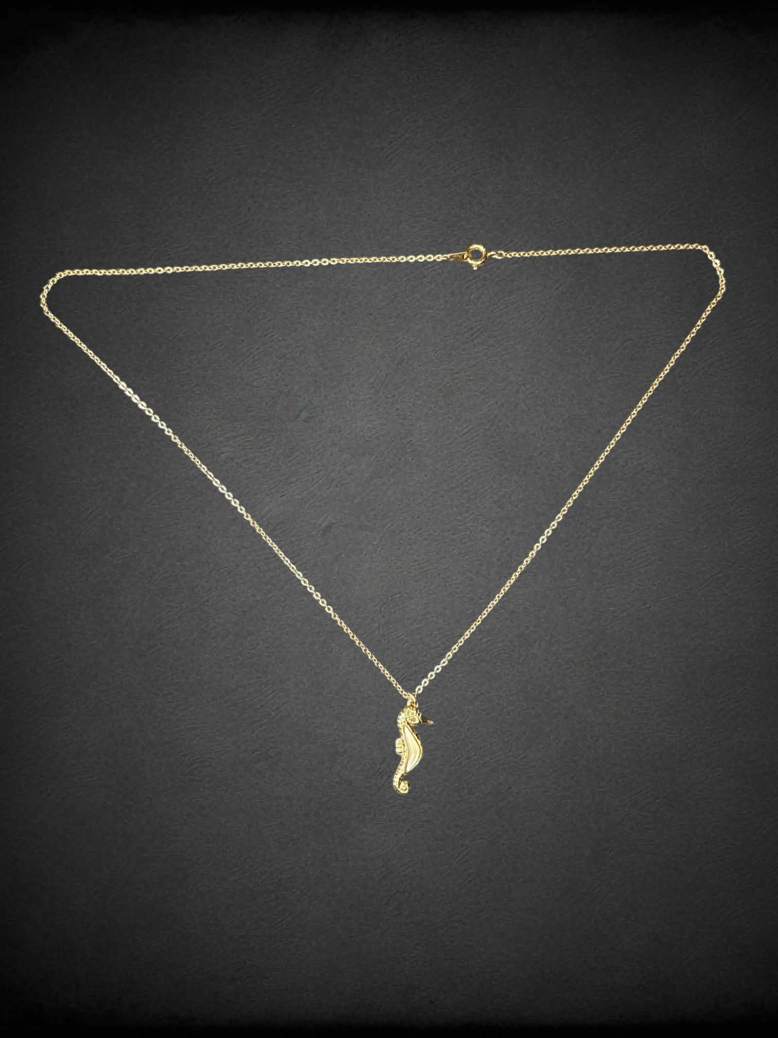 Gold chain necklace with seahorse charm