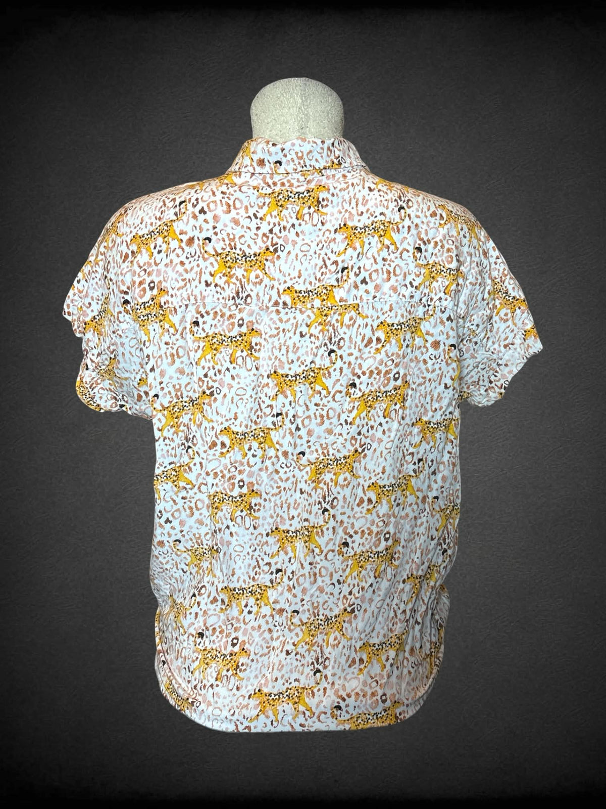 L Jane Delancey white button-up shirt with cheetah pattern, and cropped tie on front